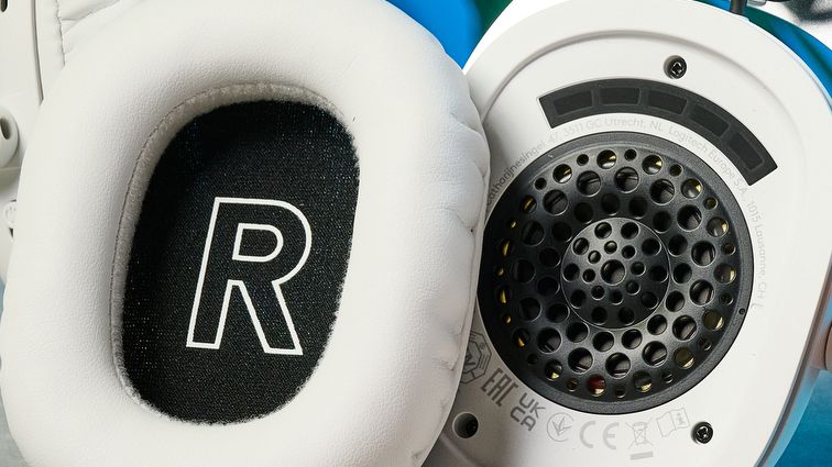 The Logitech G Pro X3 Lightspeed headset in white, on a stone surface.