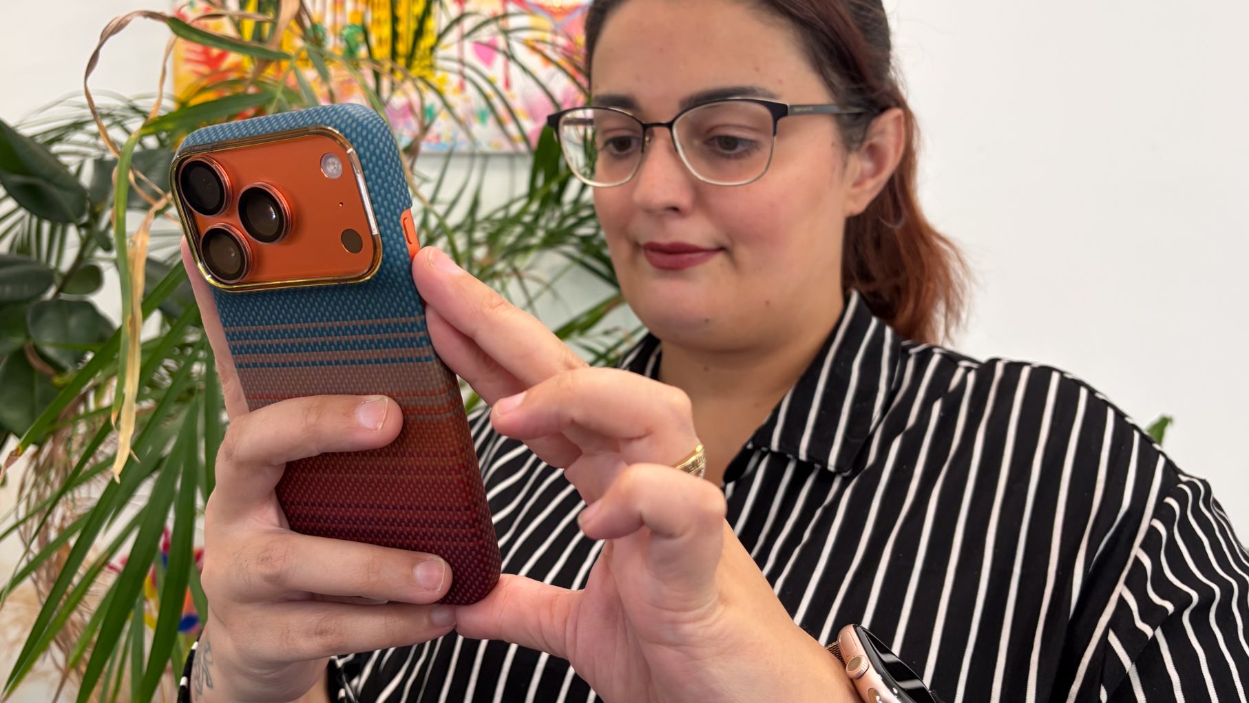 Person using an iPhone in a Pitaka iPhone 18 Pro case