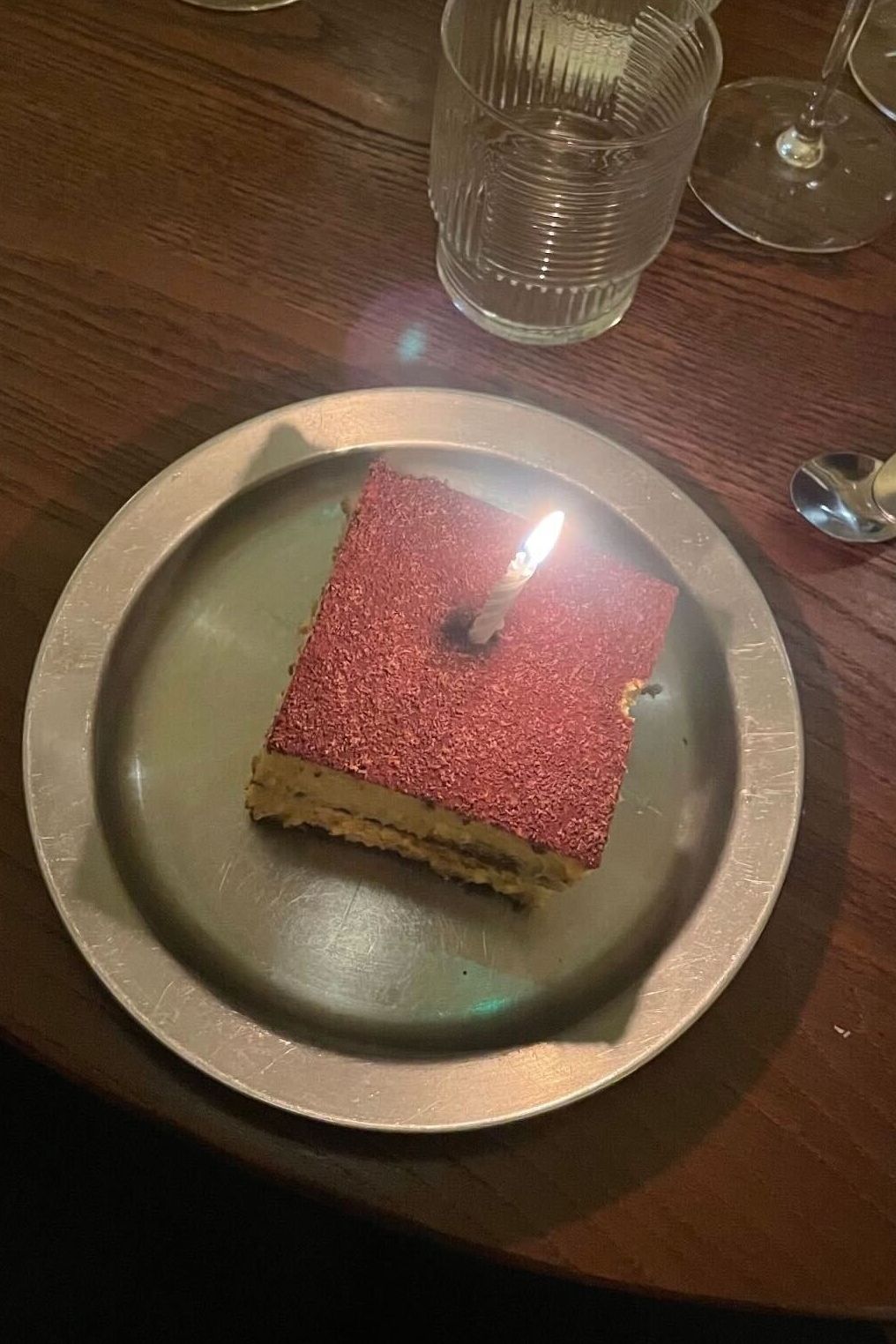 an image of the tiramisu which has a candle in it because it was a birthday and humans are really nice sometimes