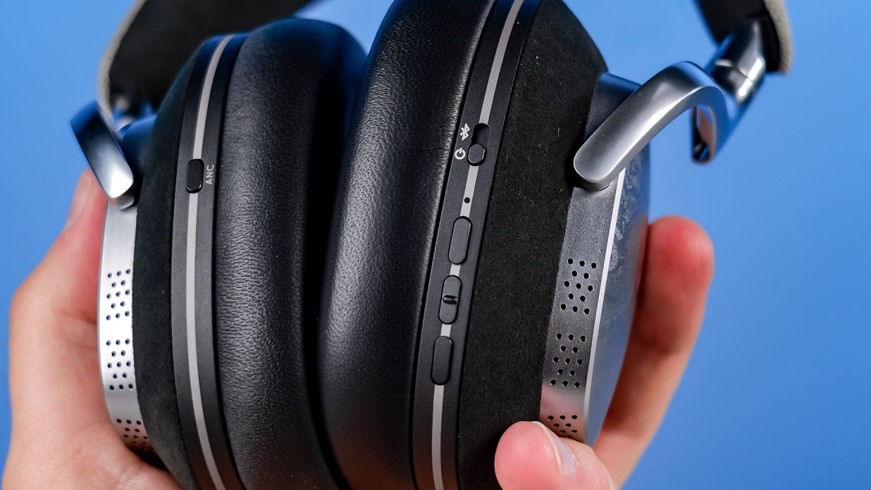 The Noble Audio FoKus Artemis in hand showing the control buttons