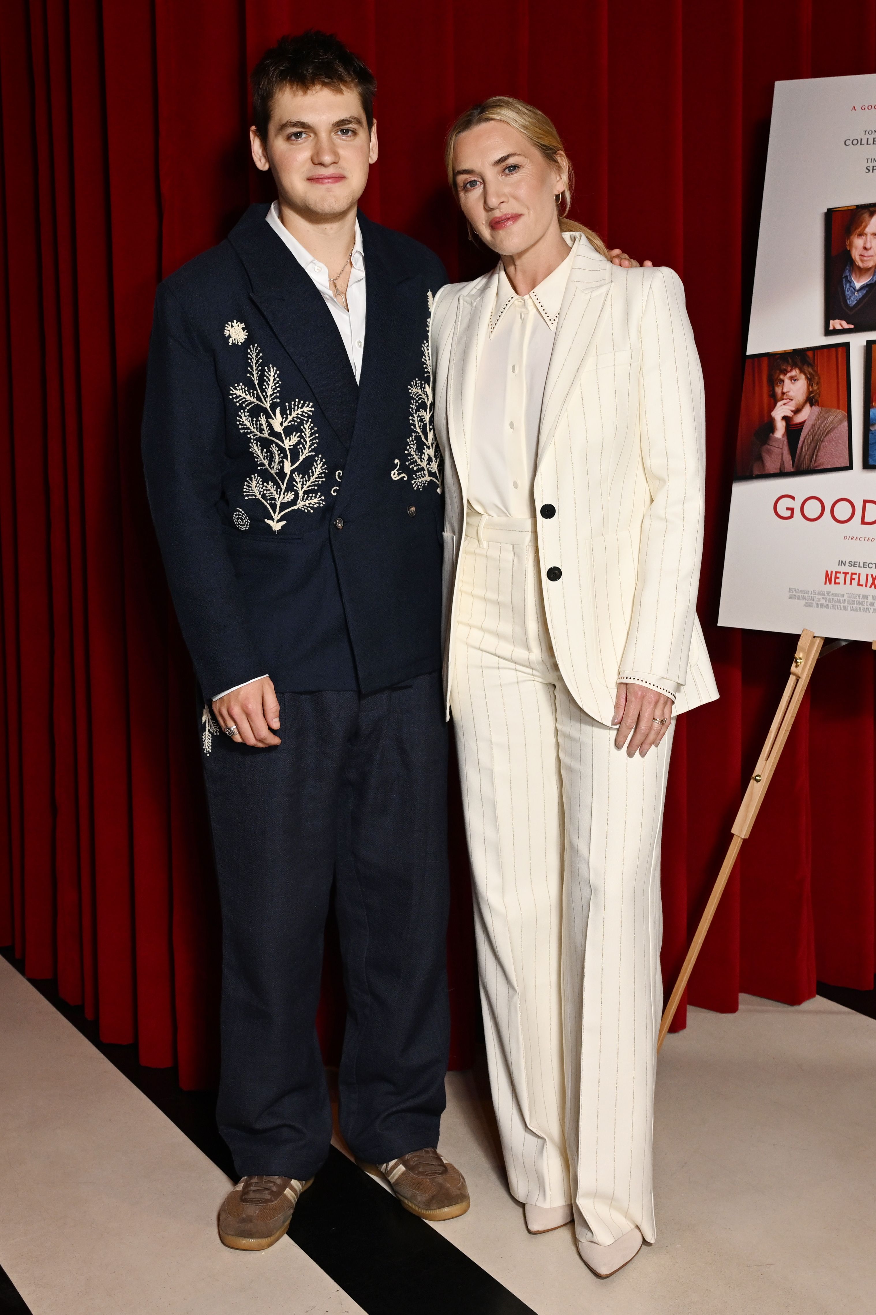 Kate Winslet wearing white pinstripe suit