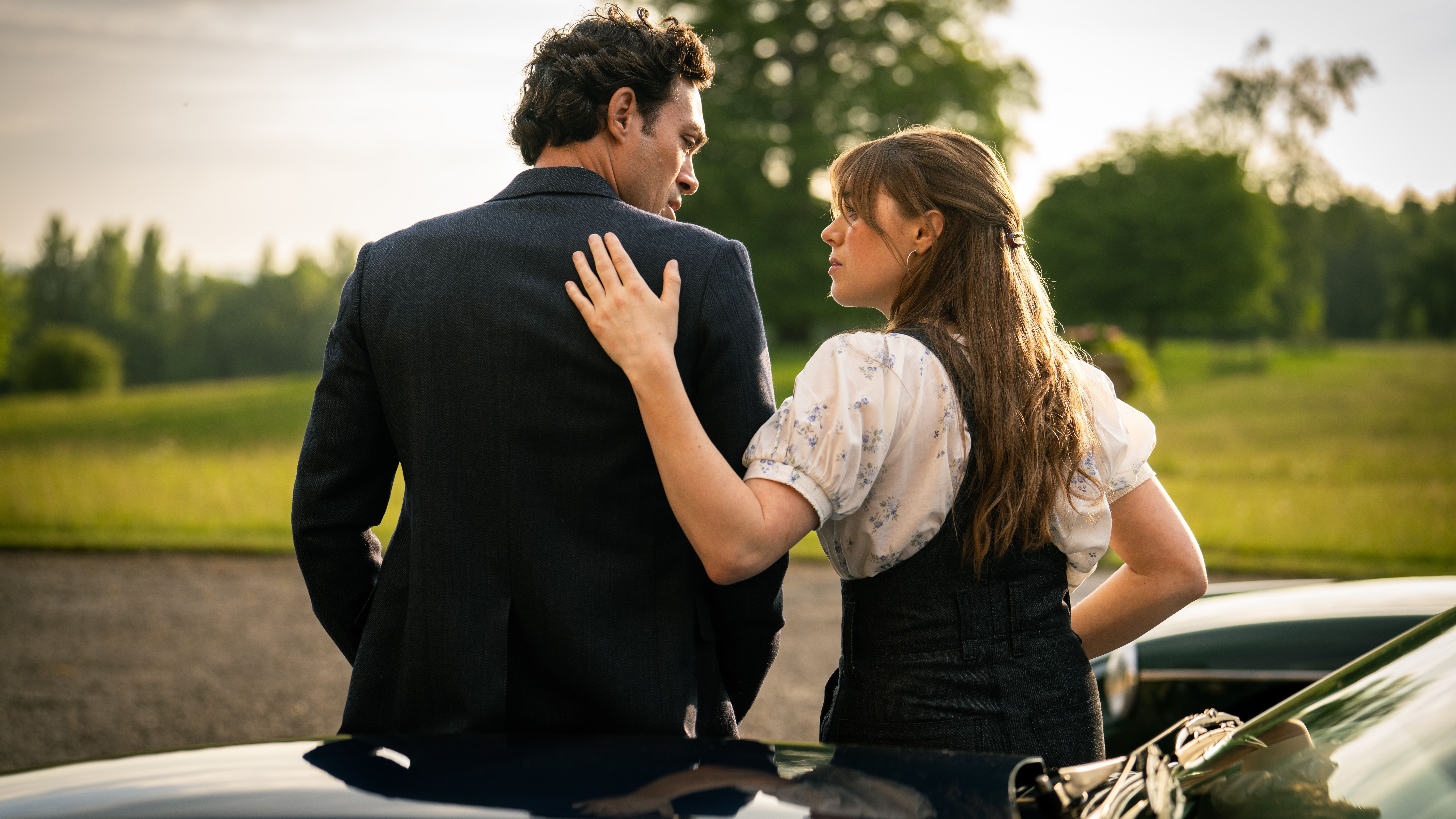 an image of Rupert and Taggie sitting on the hood of a car in Rivals S2