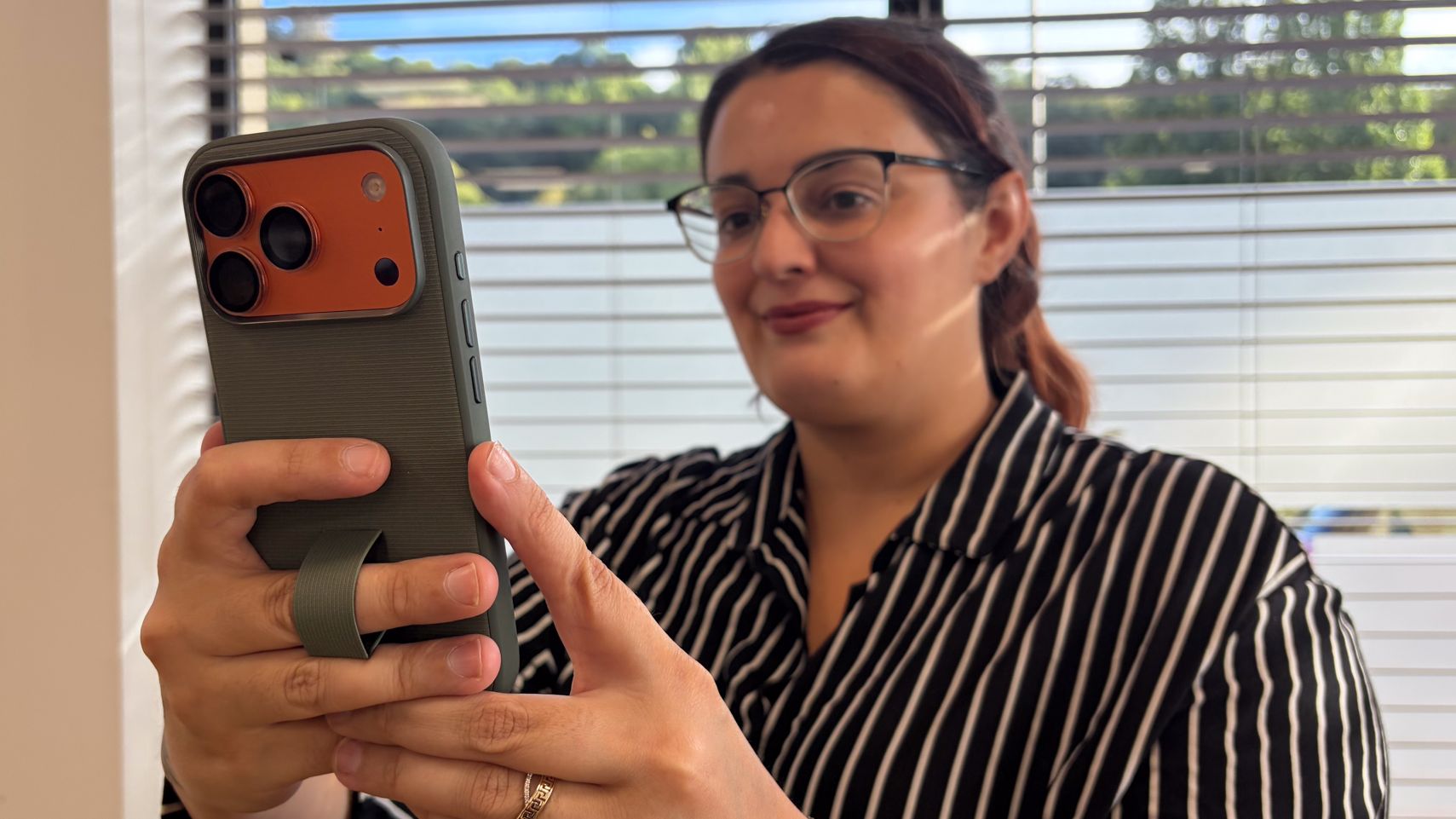 Person using an iPhone in a Peak Design iPhone 18 Pro case