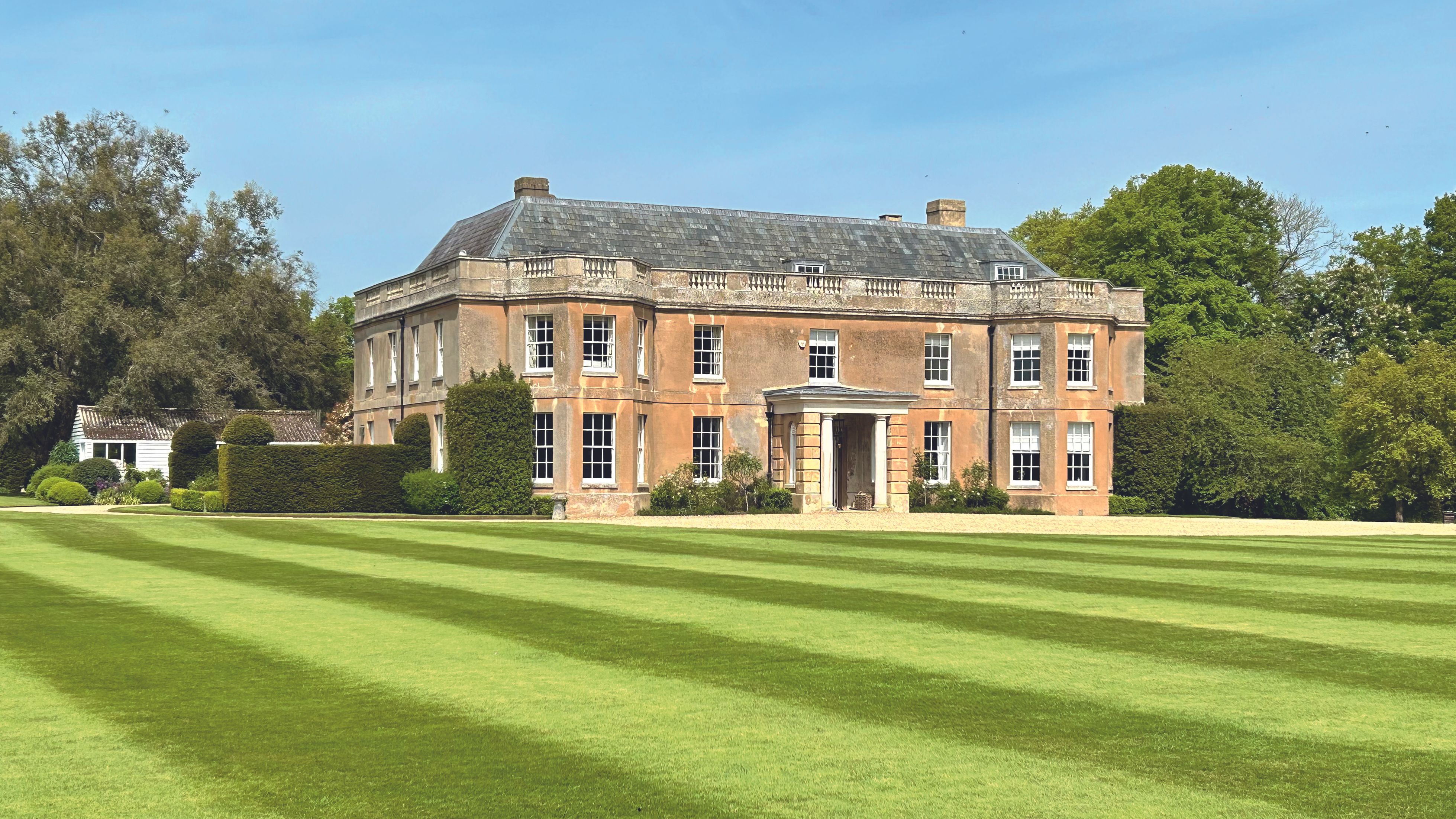 View of the house and the gardens. It is large but well set
