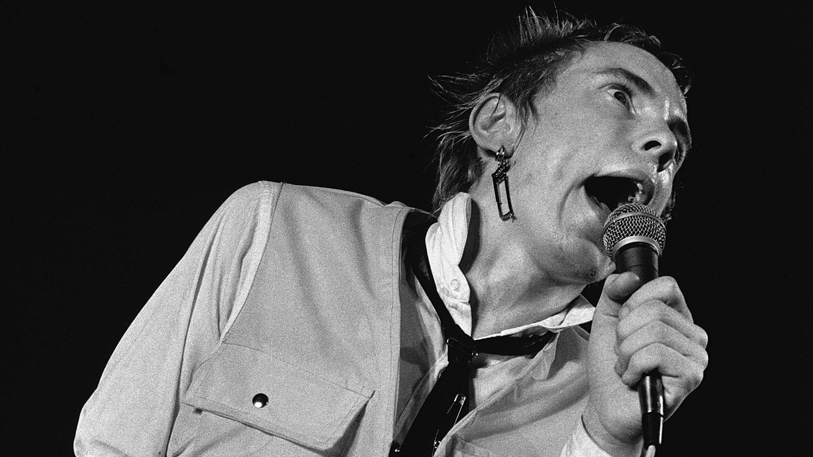 Johnny Rotten (John Lydon) singing with British punk band The Sex Pistols at the Electric Circus, Manchester, 9th December 1976. (Photo by &amp;copy; Hulton-Deutsch Collection/CORBIS/Corbis via Getty Images)