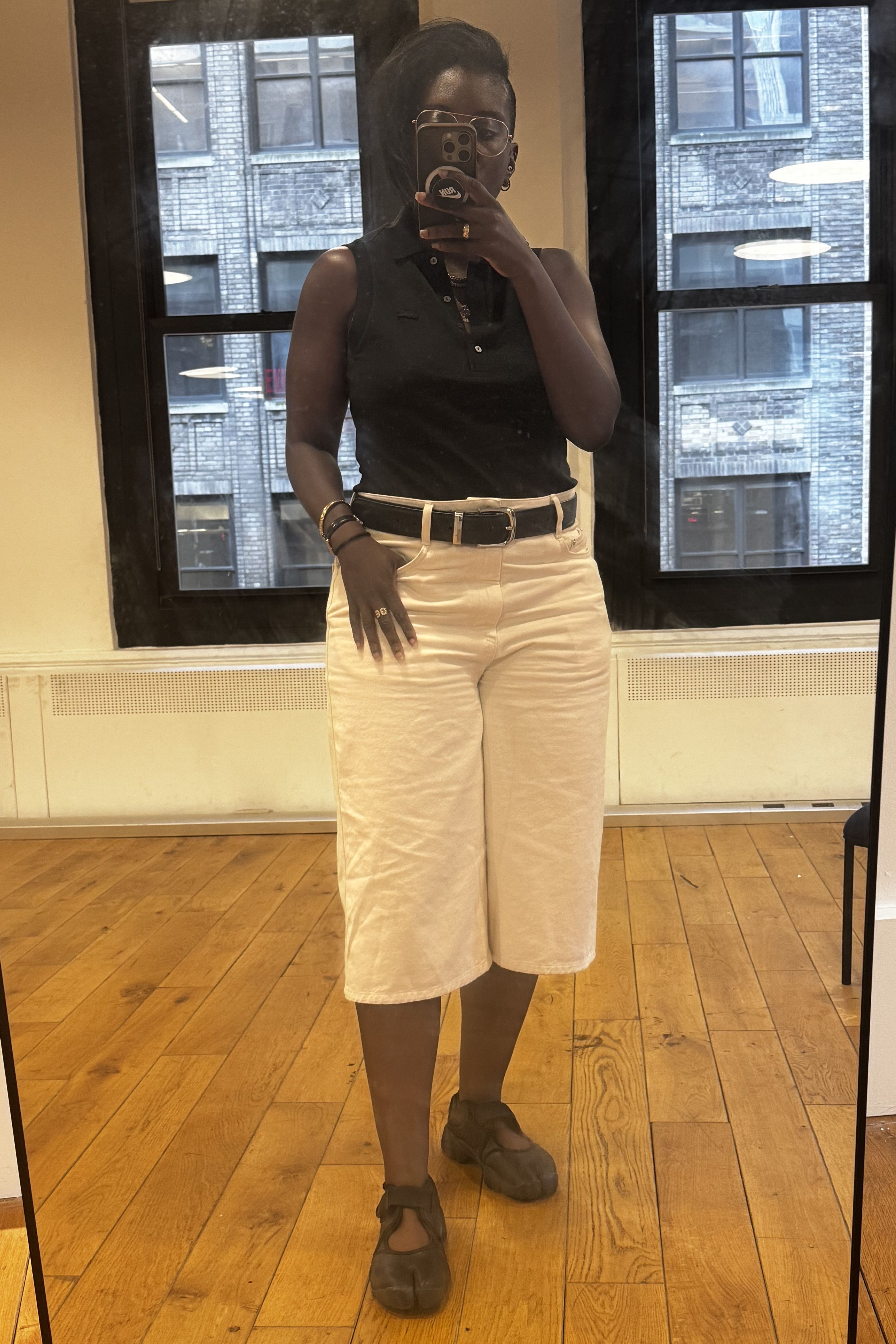 Nikki Ogunnaike wearing denim bermuda shorts
