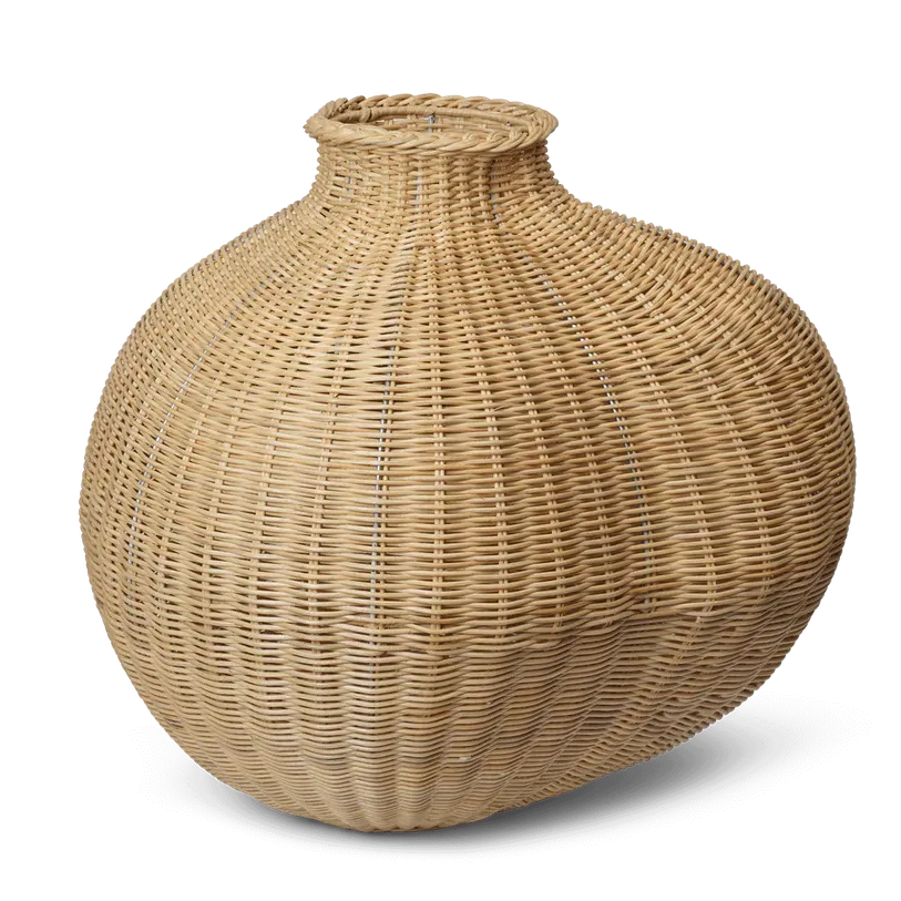 Asymmetrical wicker vase on white background