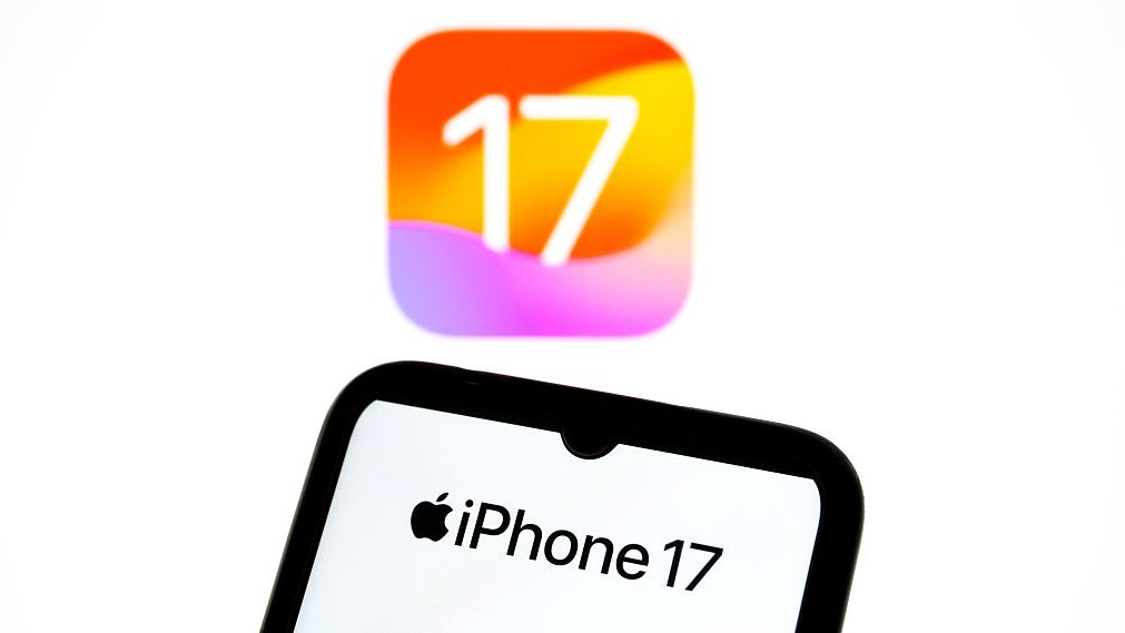 The iPhone 17 logo appears on a smartphone screen and as the background on a laptop computer screen in this photo illustration in Athens, Greece, on September 19, 2025.