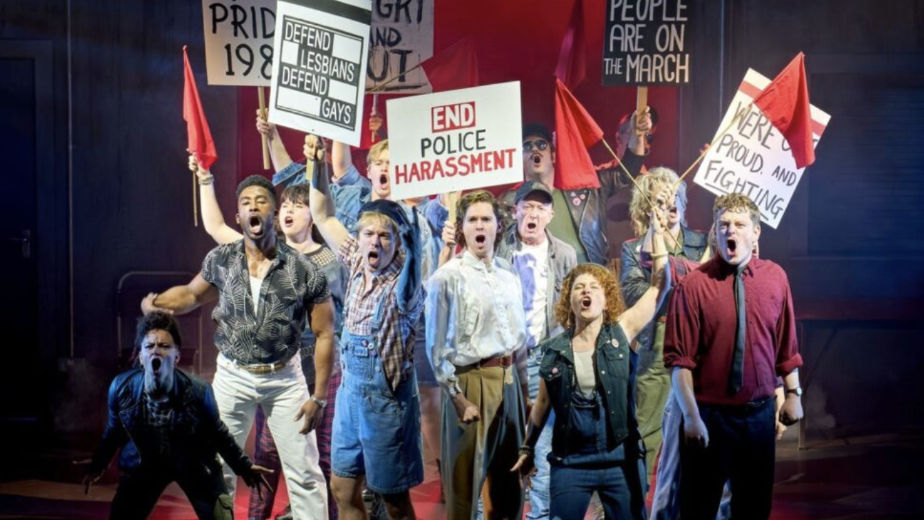 an image of the musical Pride where the miners and allies are marching and protesting