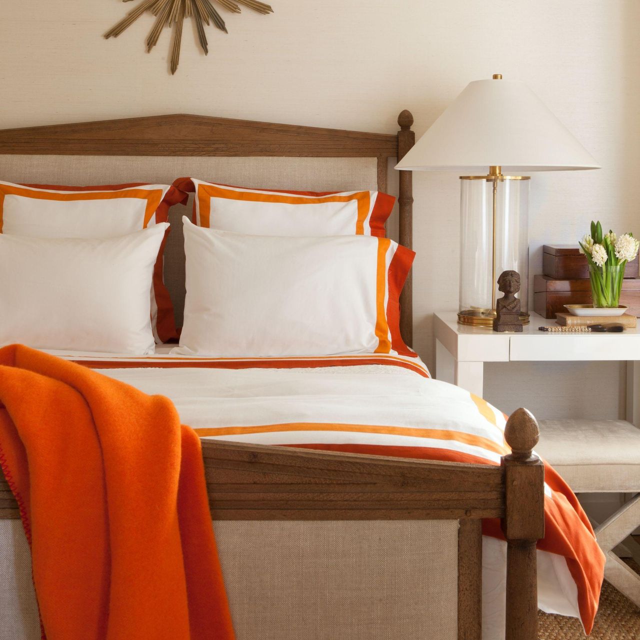 bedroom with orange edged sheets