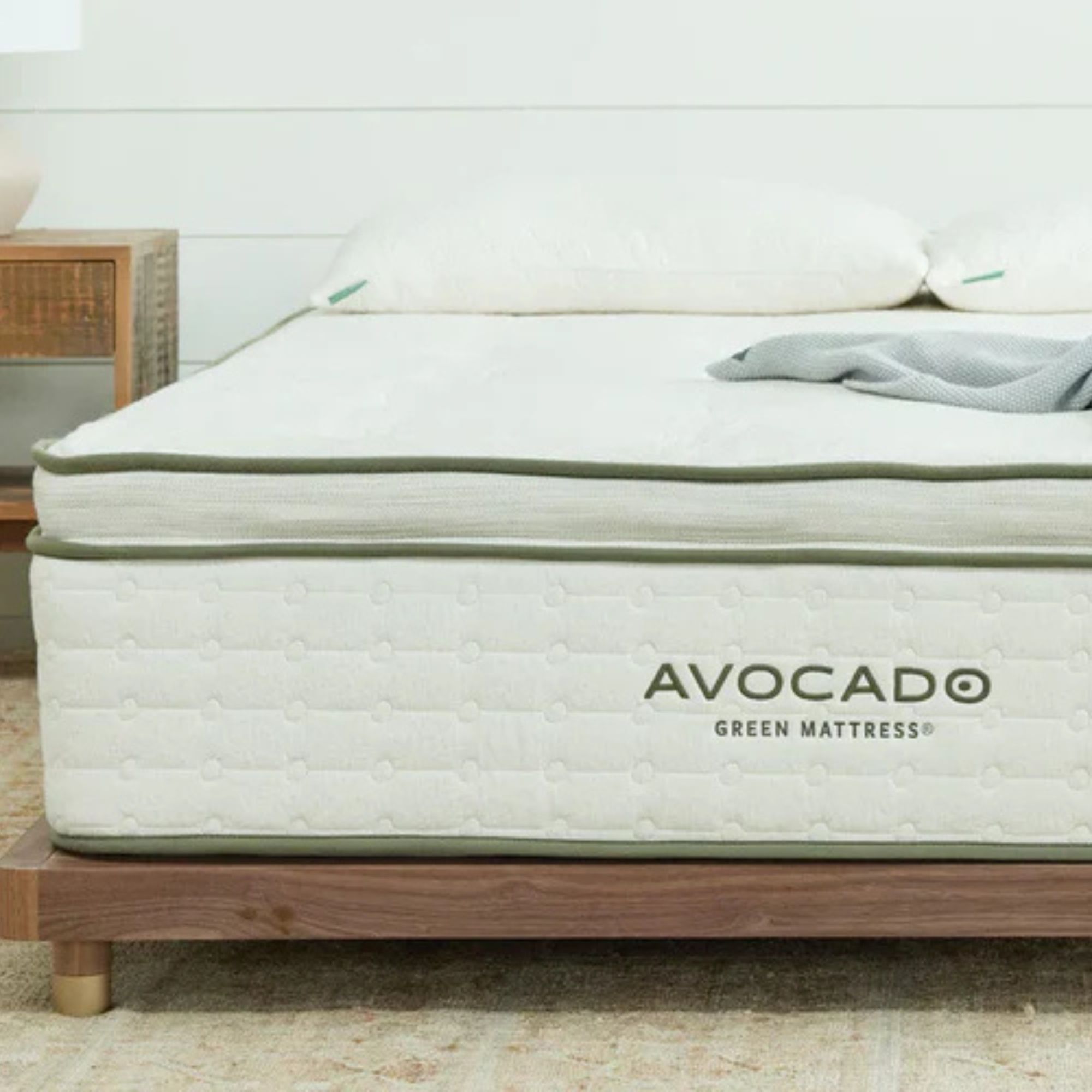 Pillows on the Avocado Mattress on a bed against a white wall. 