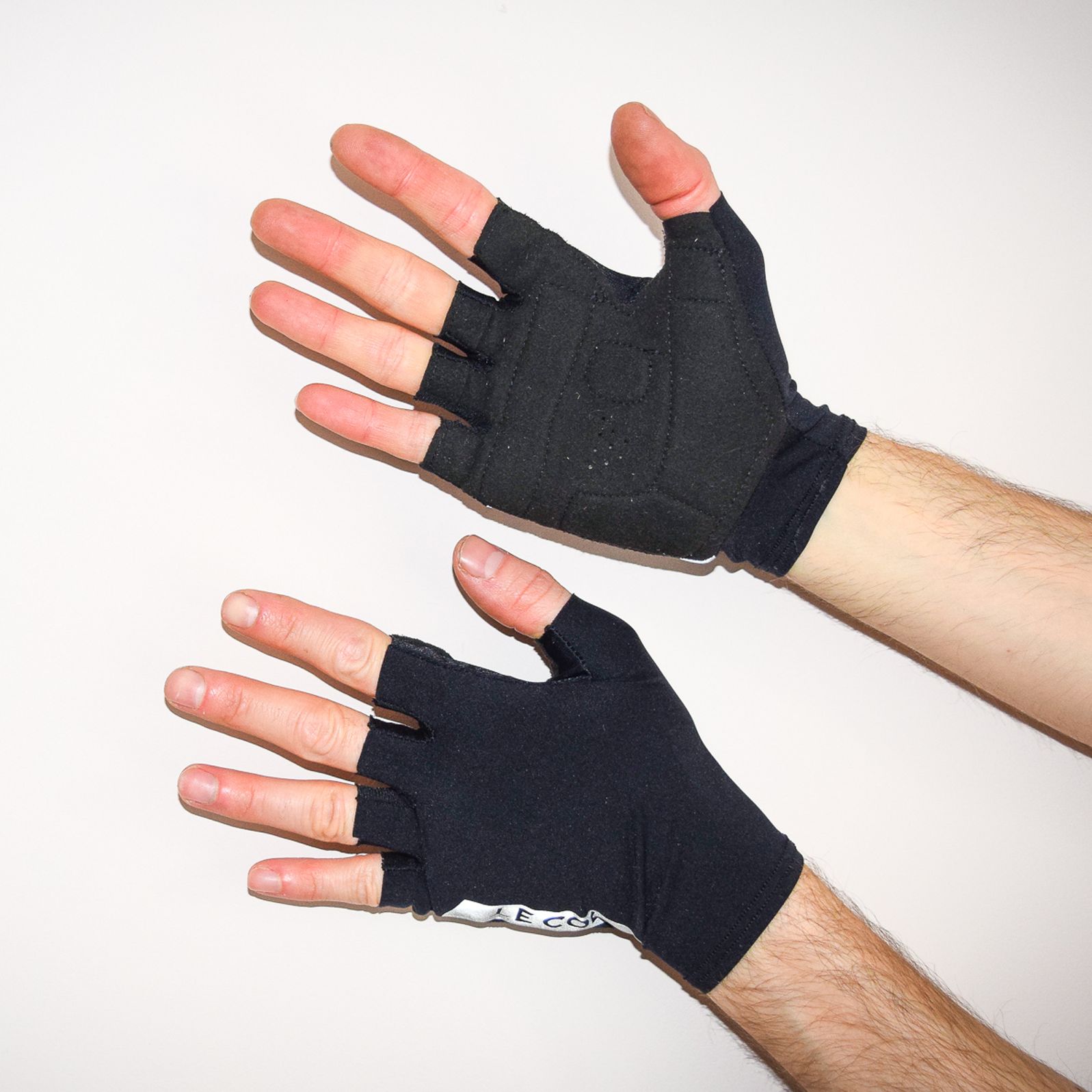 Le Col cycling gloves being worn against a white background