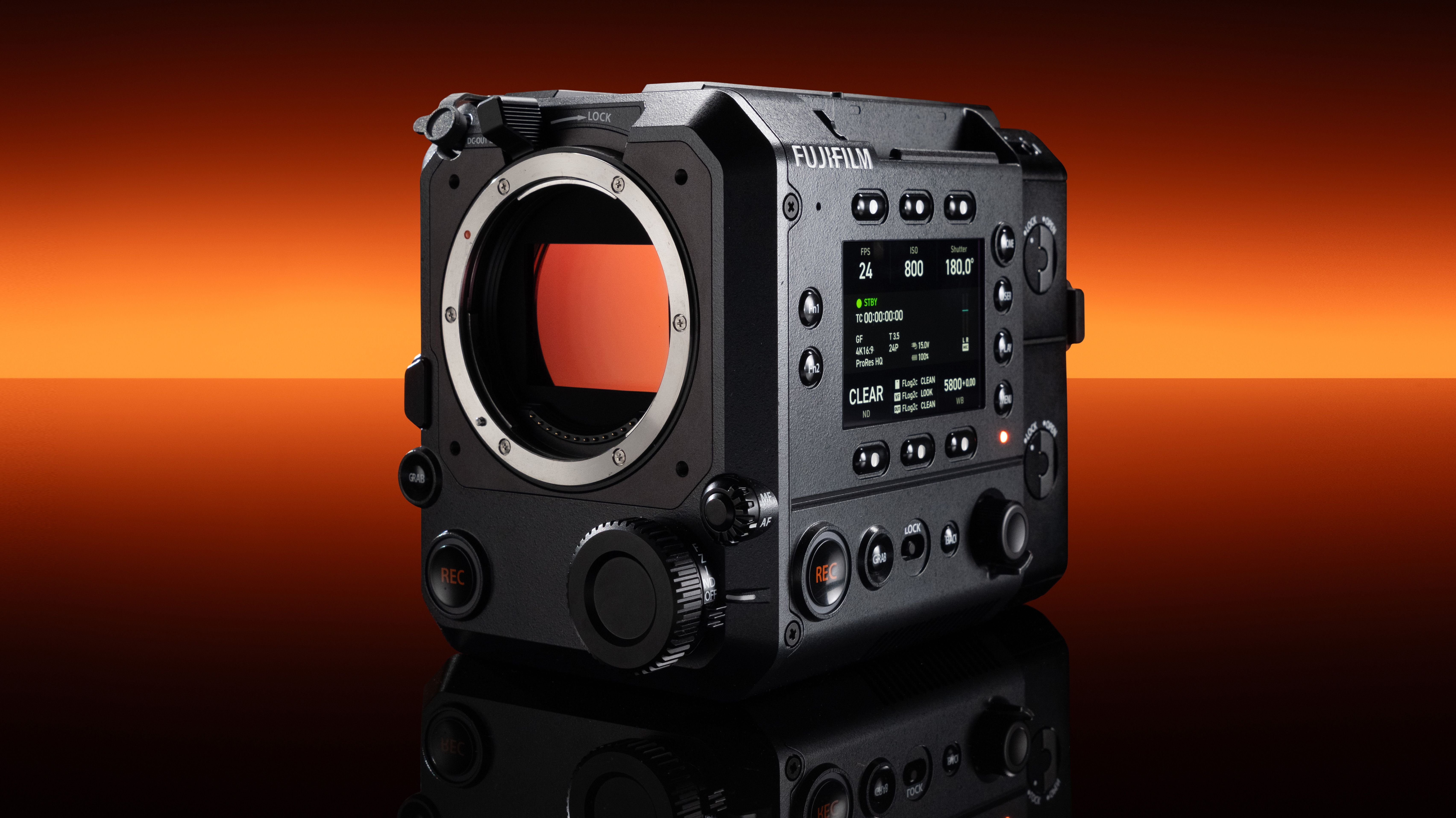 Fujifilm GFX Eterna 55 cinema camera in front of a strip of orange light