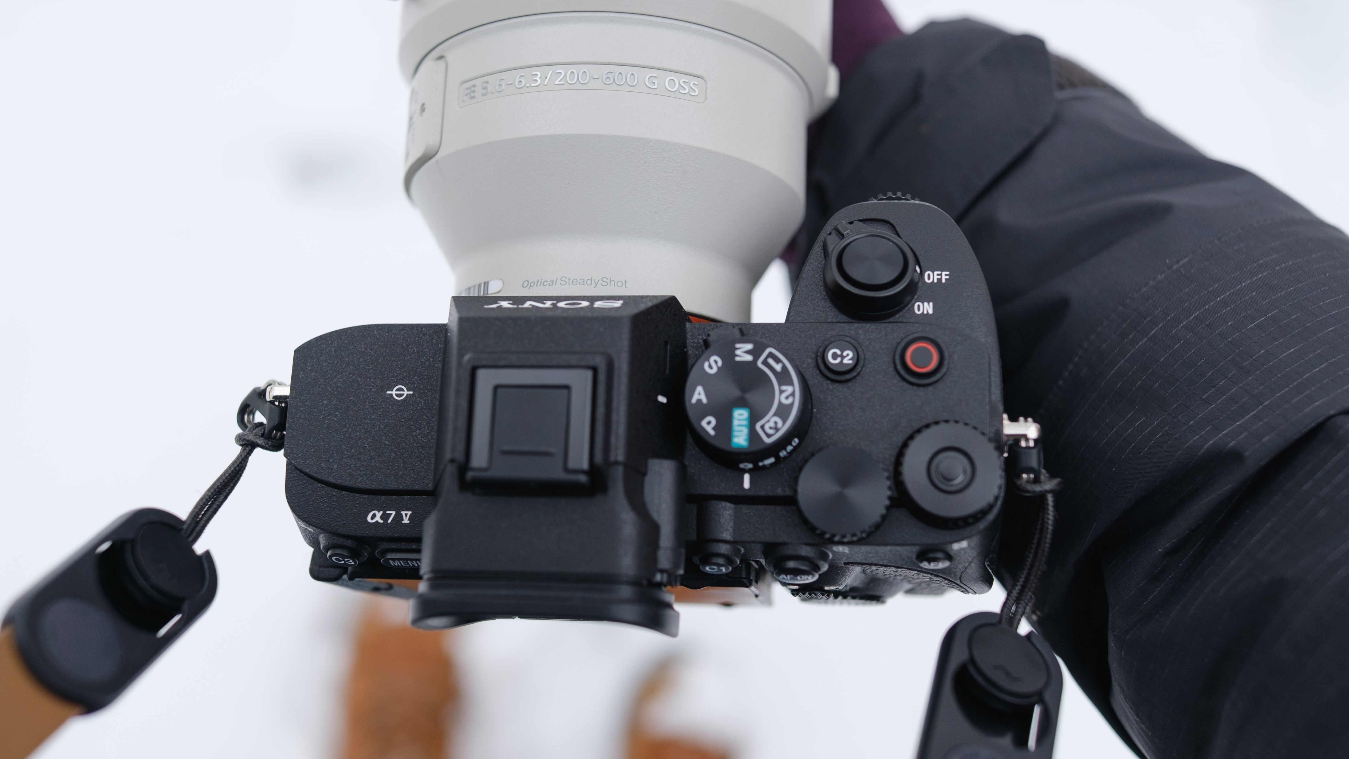 The Sony A7 V covered in snow