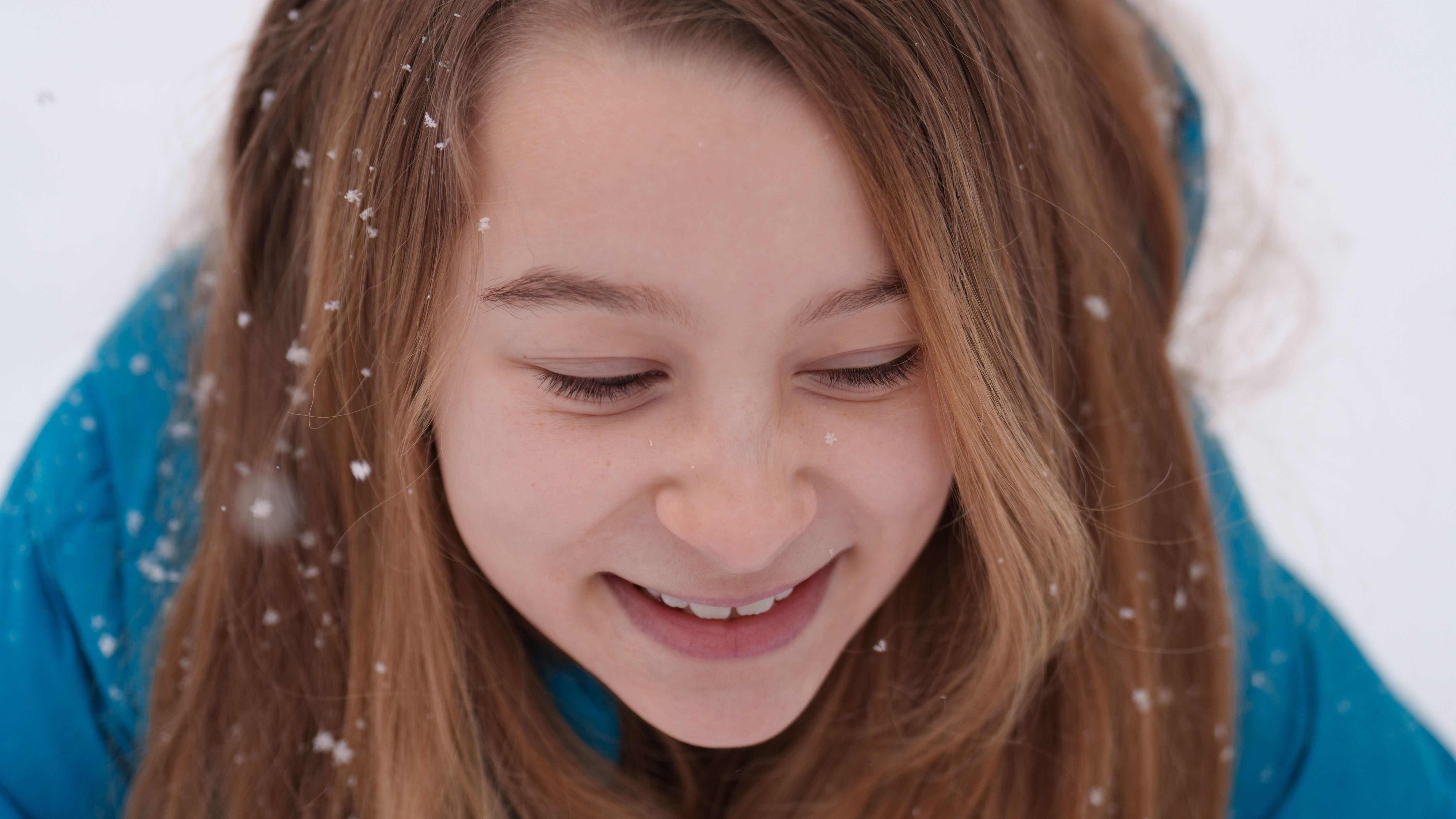 A portrait taken in the snow with a white background