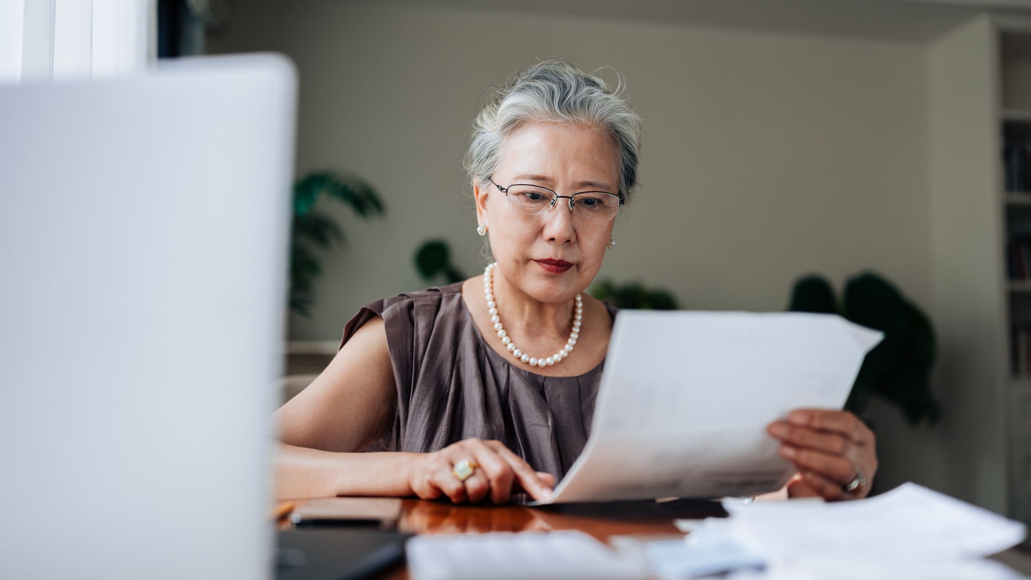 A woman managing personal banking and finance at home