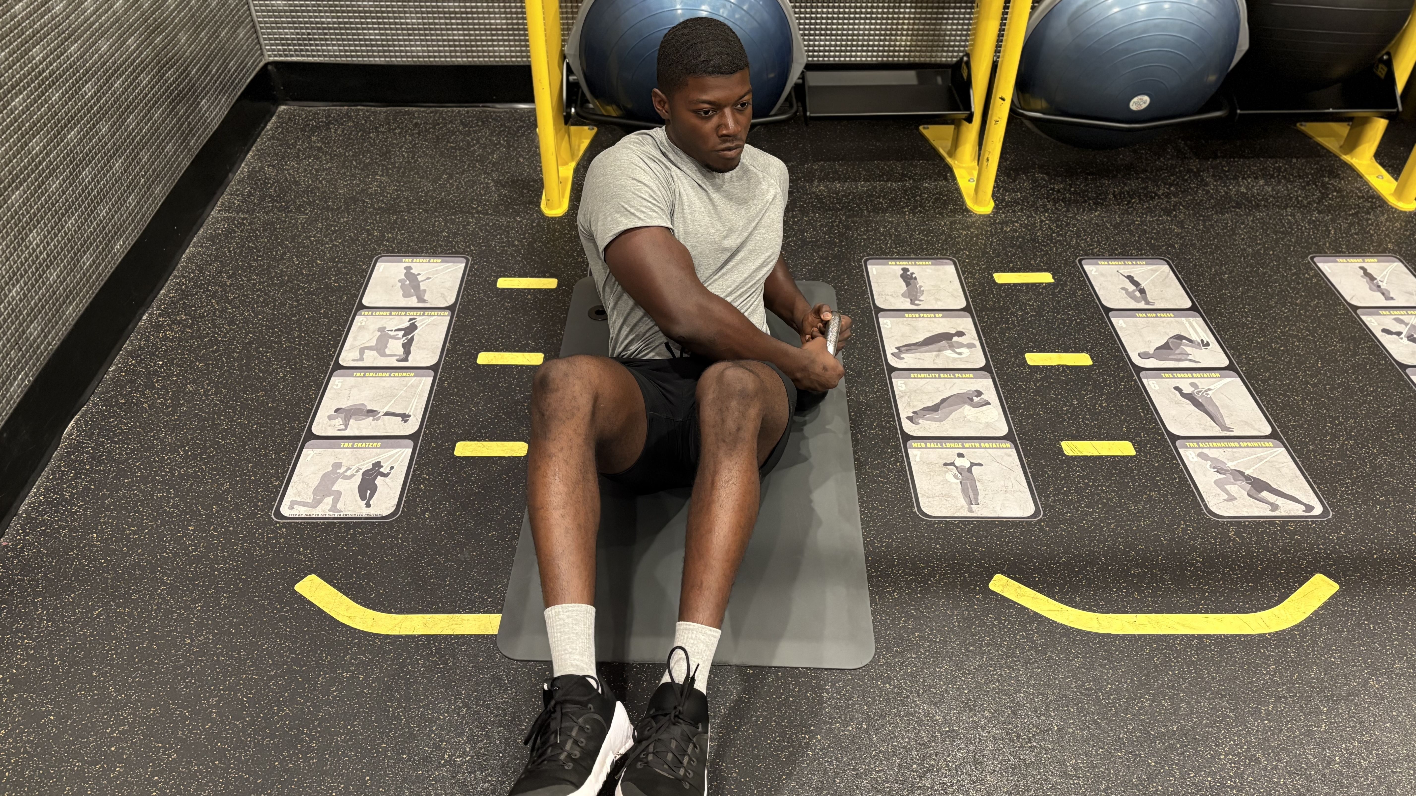 Man exercises with kettlebell in gym
