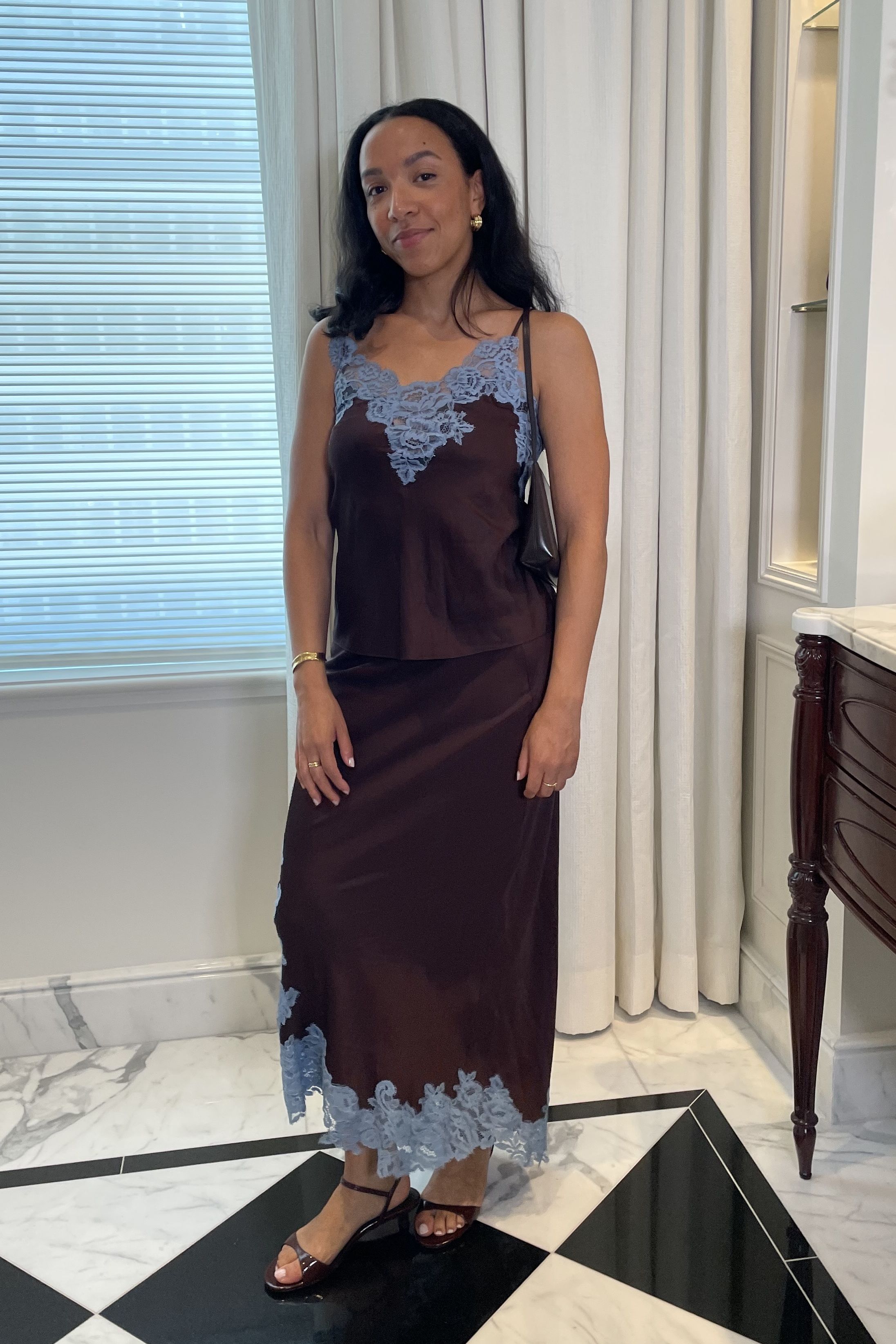 Lauren Tappan wearing a brown and blue ALC satin set