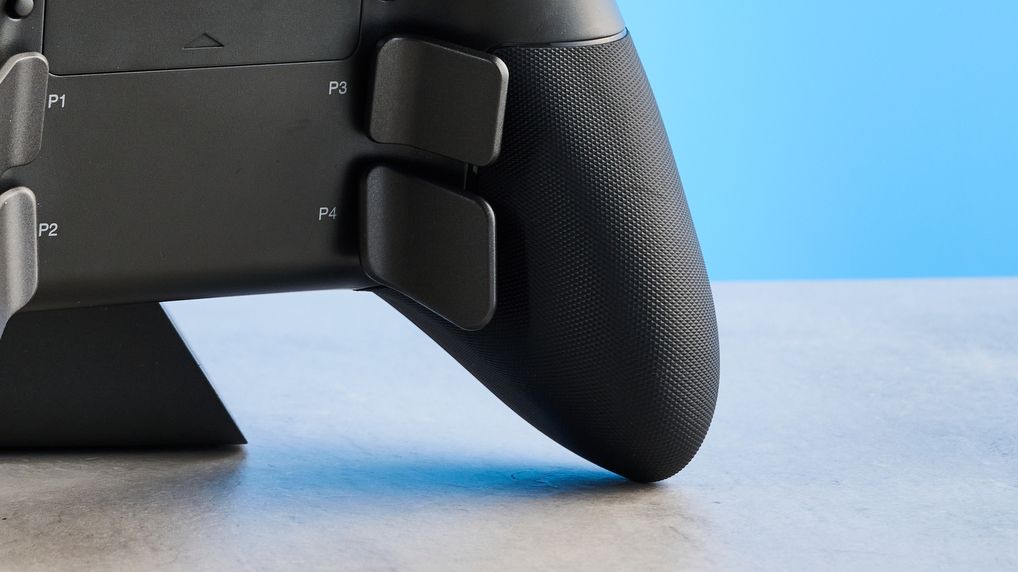 The SteelSeries Aeon Pro on a stone surface against a blue background