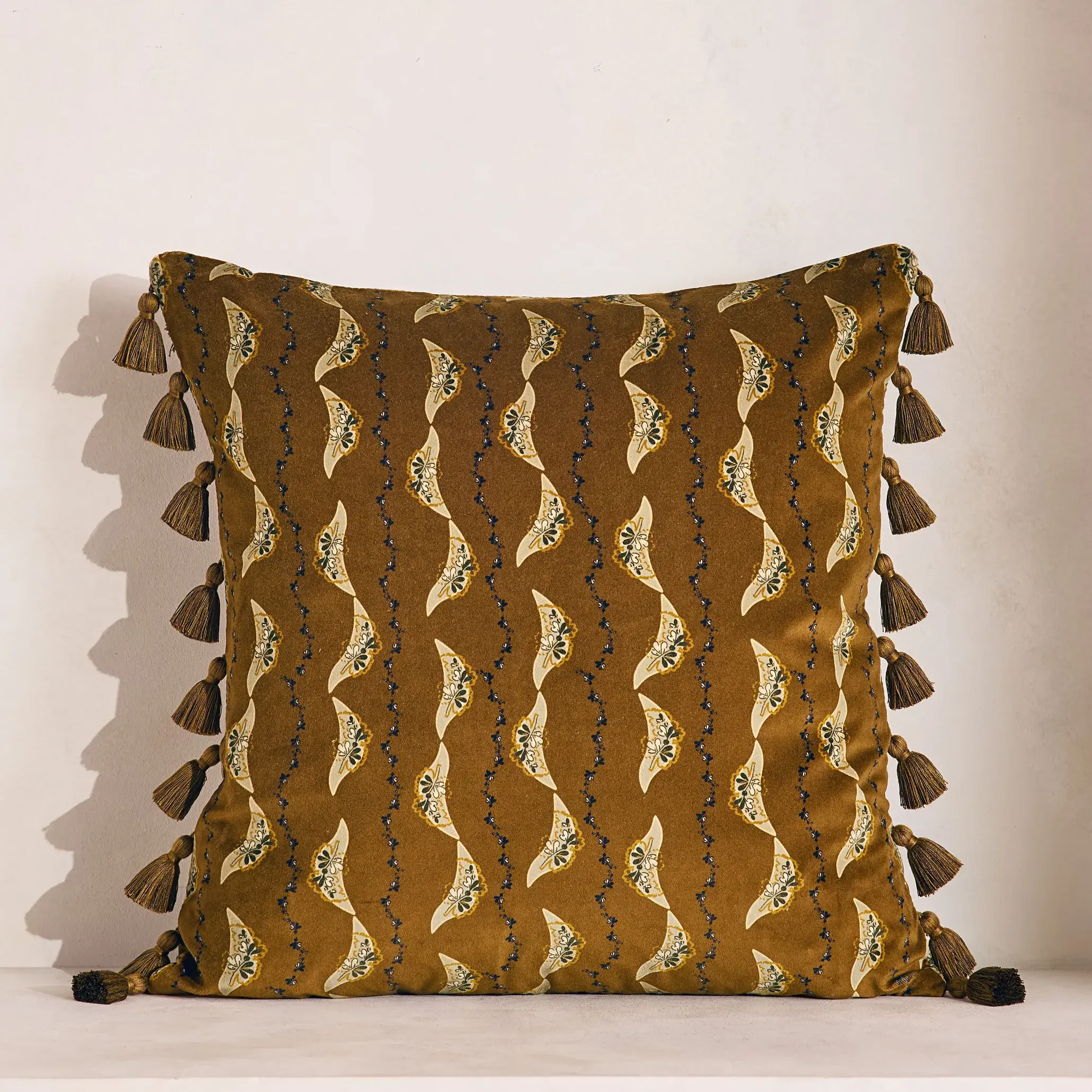 olive cushion with tassel border