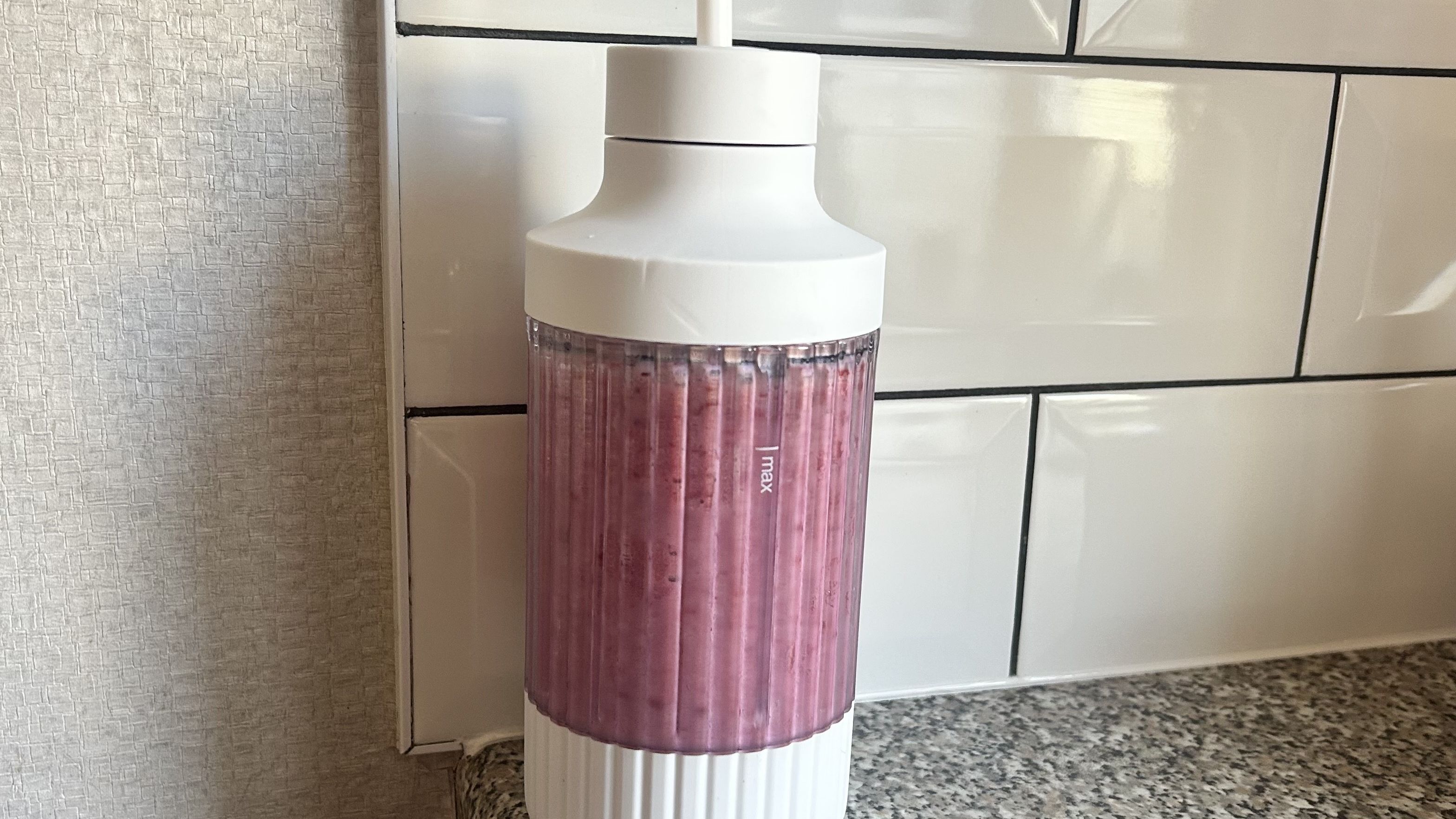 A berry smoothie made using the Beast Mighty 850 Plus in the included blend cup