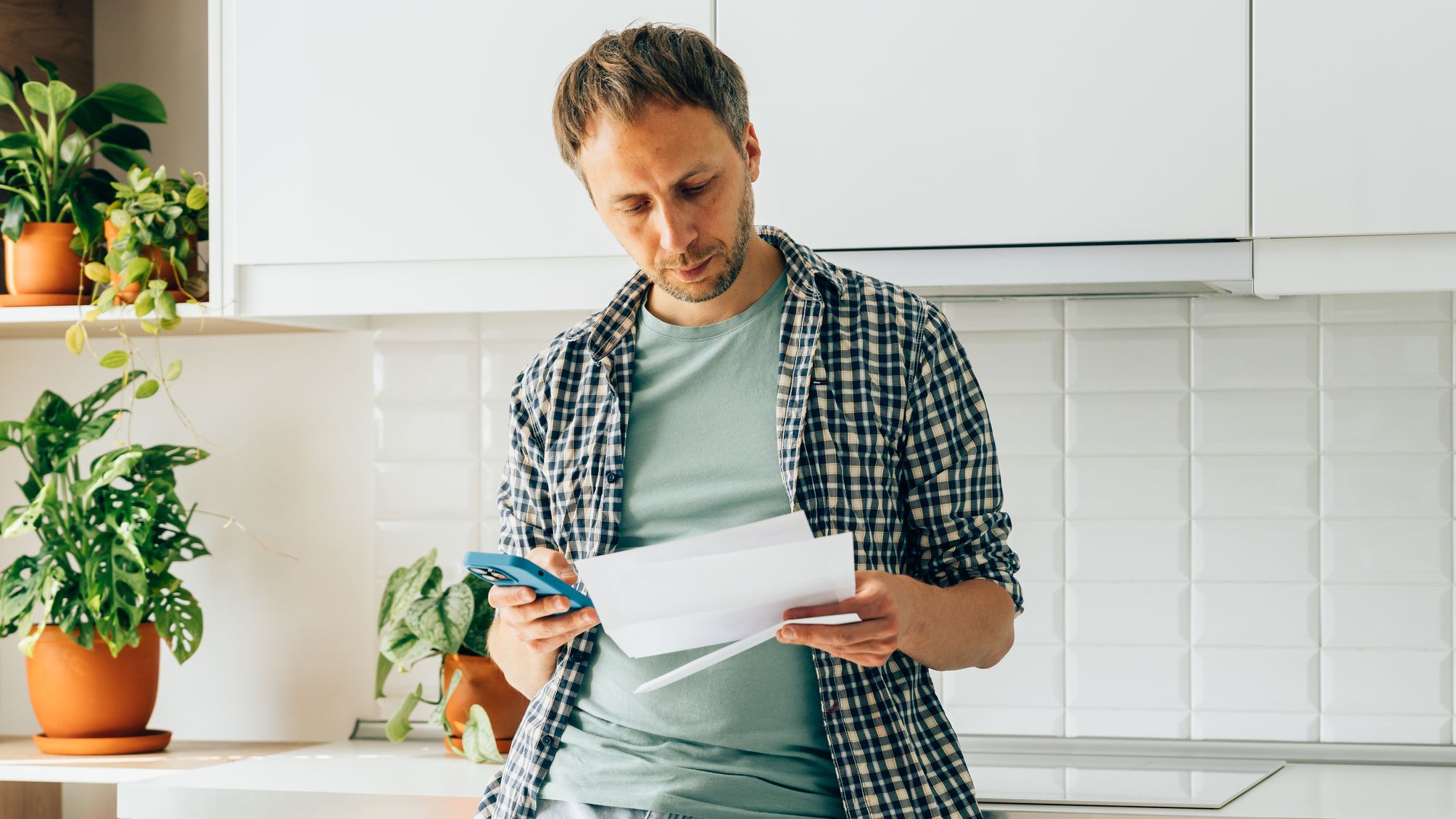 A man weighing options on how to save money on his cell phone plan