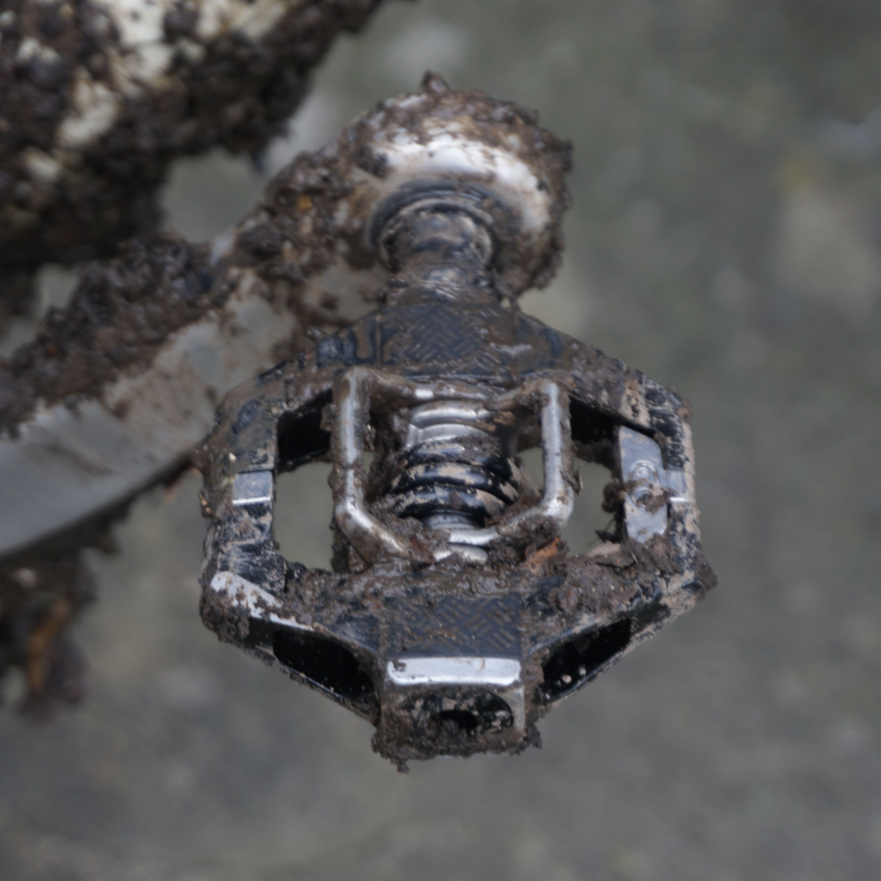 A close up of a black gravel bike pedal