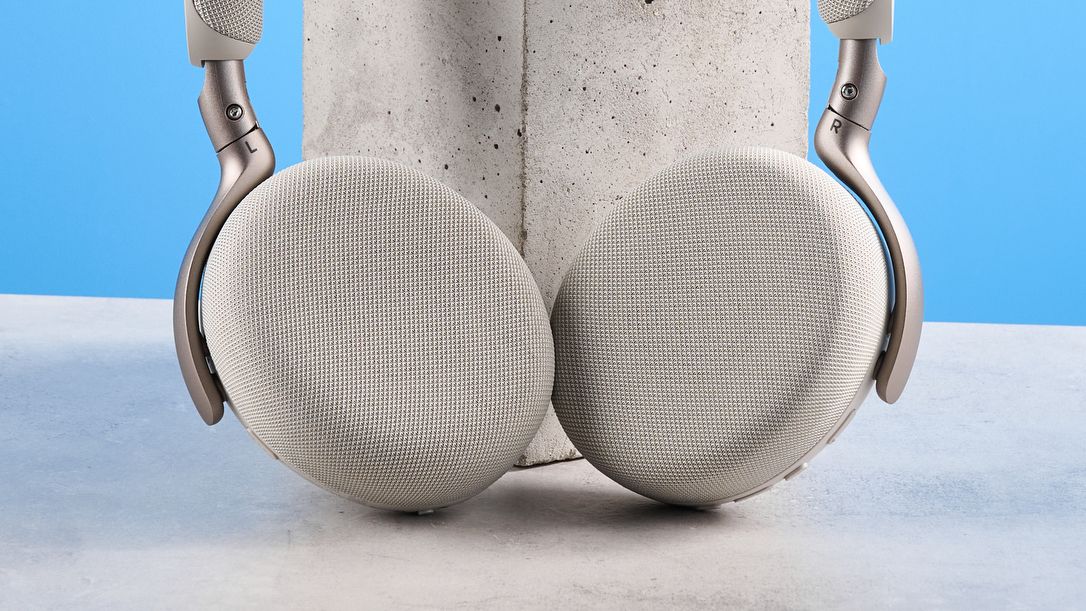 Jabras Evolve3 75 conferencing headset on a stone surface with a blue background