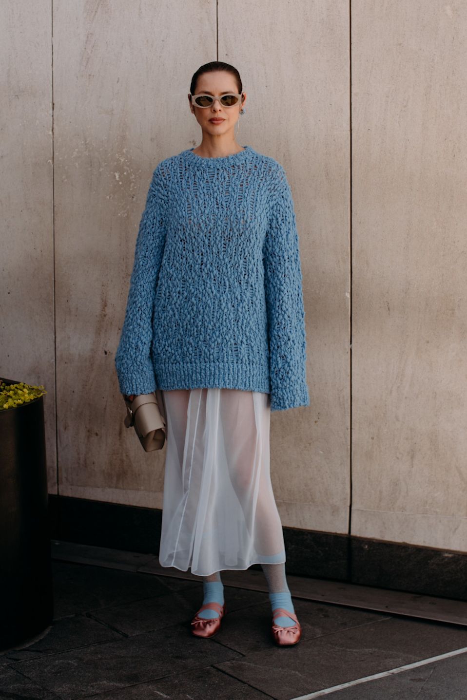 woman wearing sheer skirt and sweater