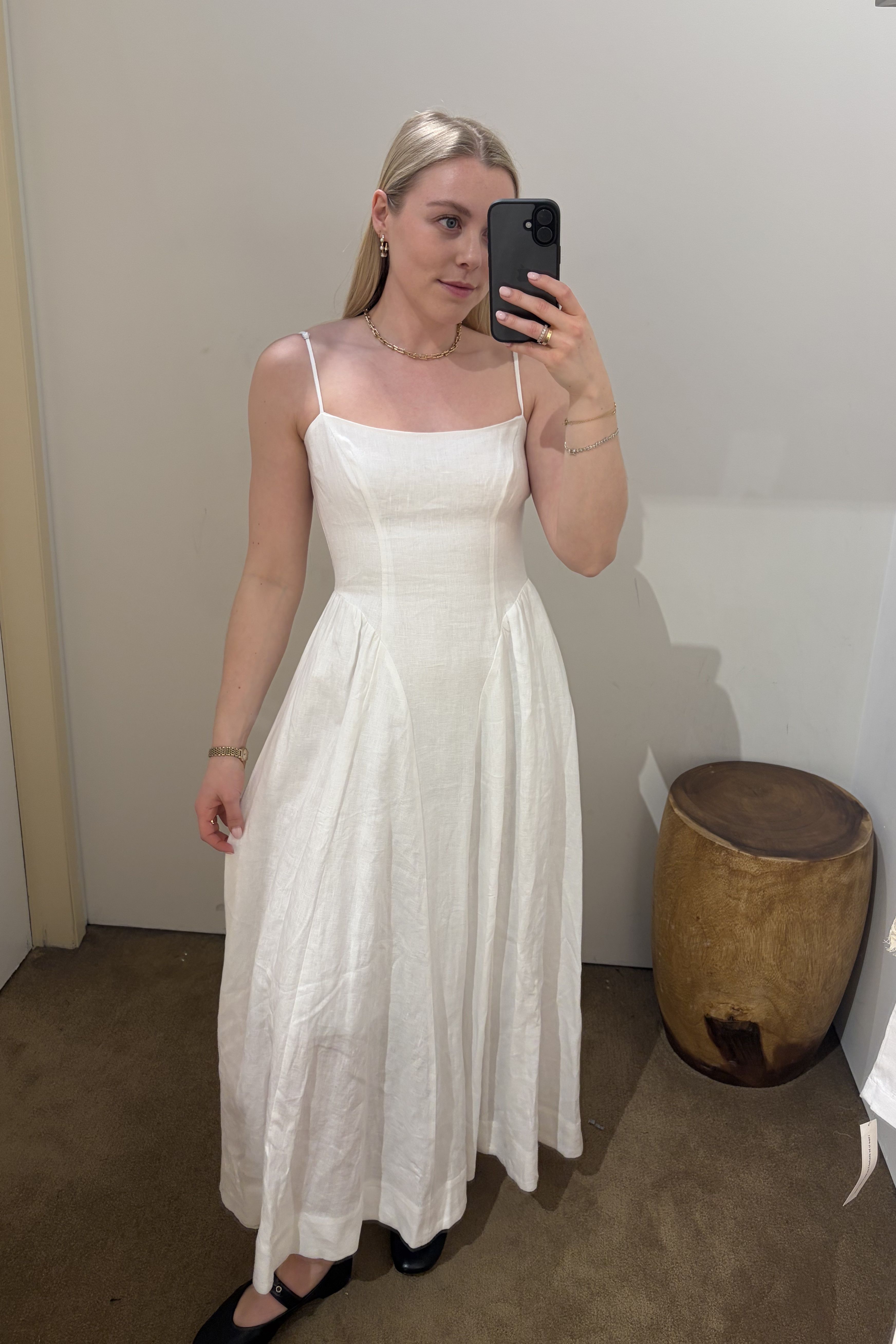 Woman wears white linen dress