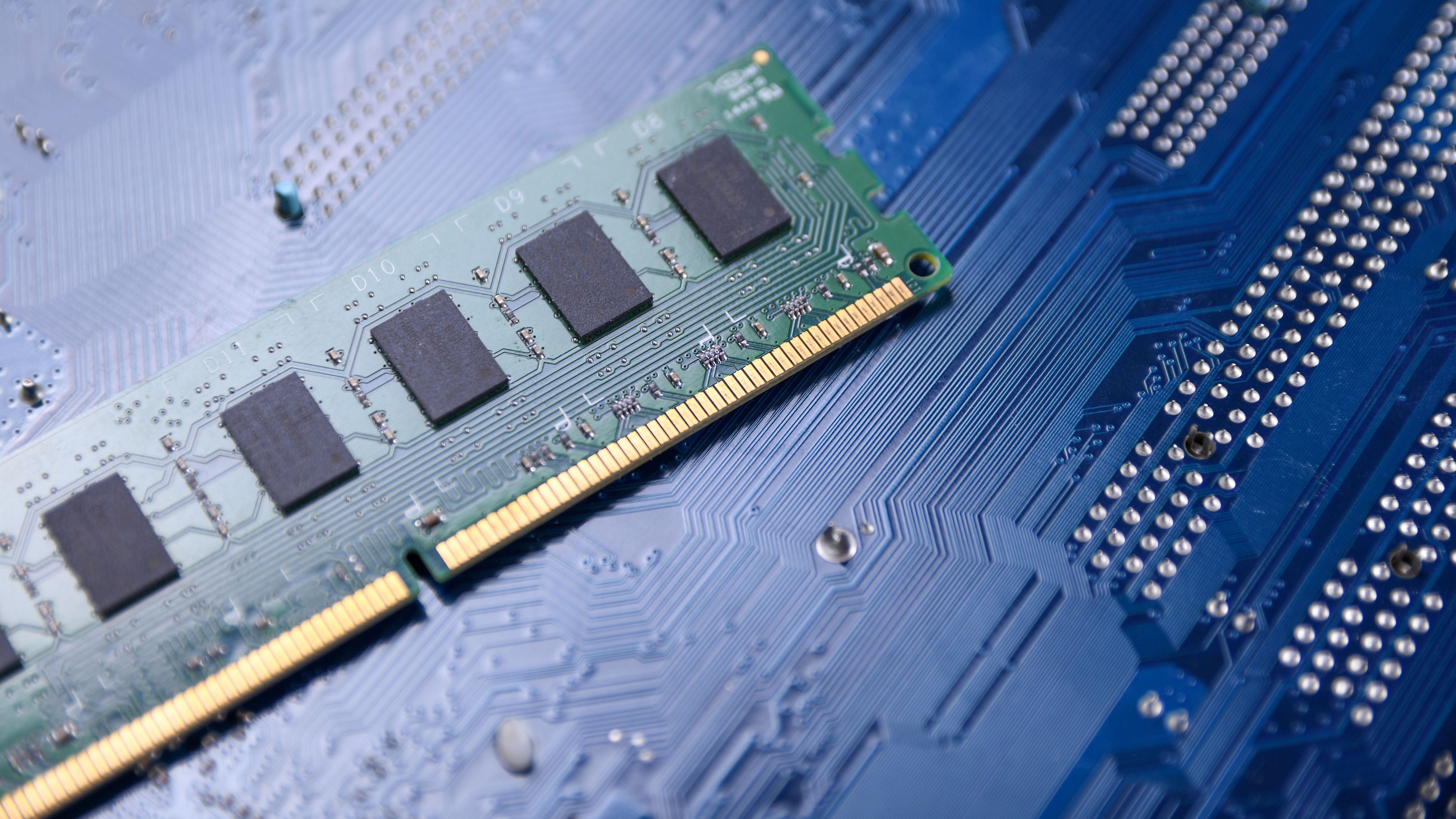 Computer memory RAM on motherboard background . Close up. system, main memory, random access memory, onboard, computer detail. Computer components . DDR3. DDR4. DDR5