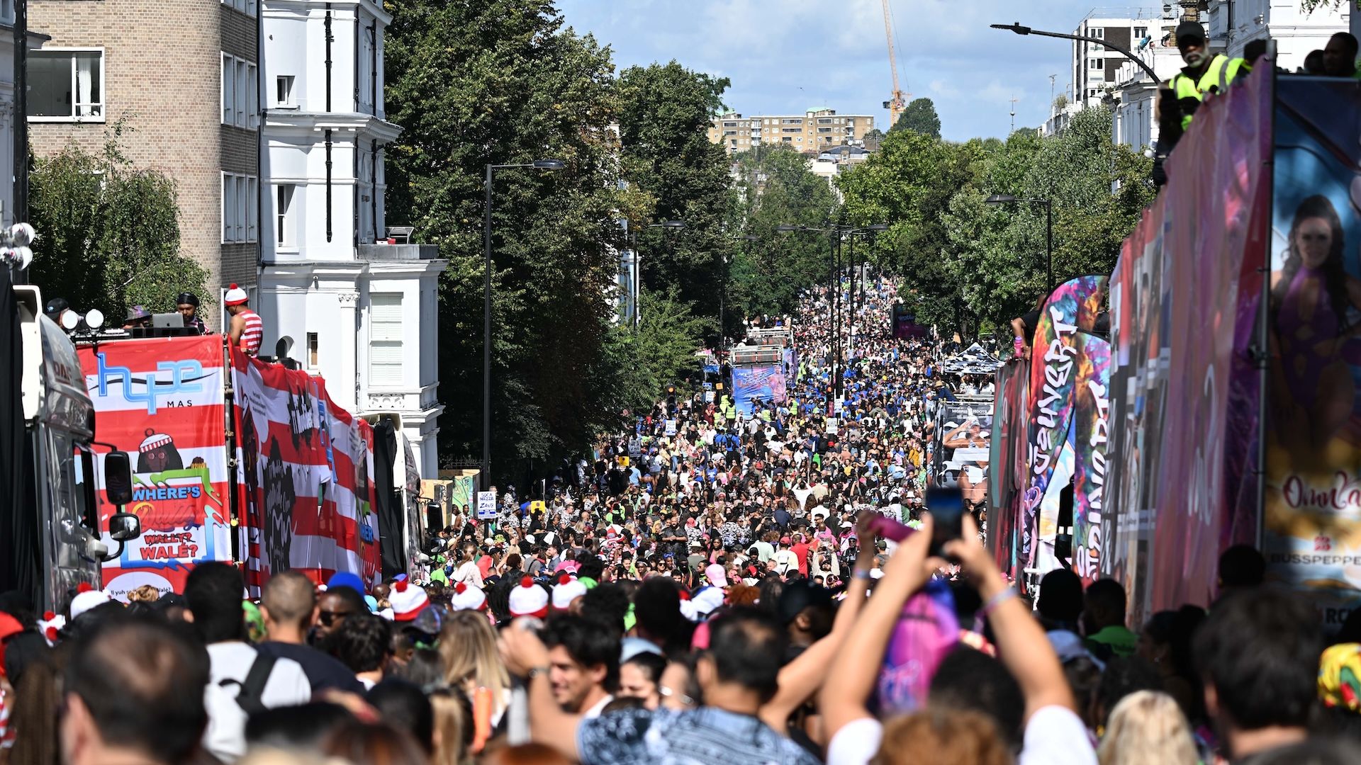 LONDON, UNITED KINGDOM - AUGUST 25: Thousands of people from all over the world crowd the streets during the Notting Hill Carnival, known as the largest street carnival in Europe, in London, United Kingdom on August 25, 2024. (Photo by Rasid Necati Aslim/Anadolu via Getty Images)