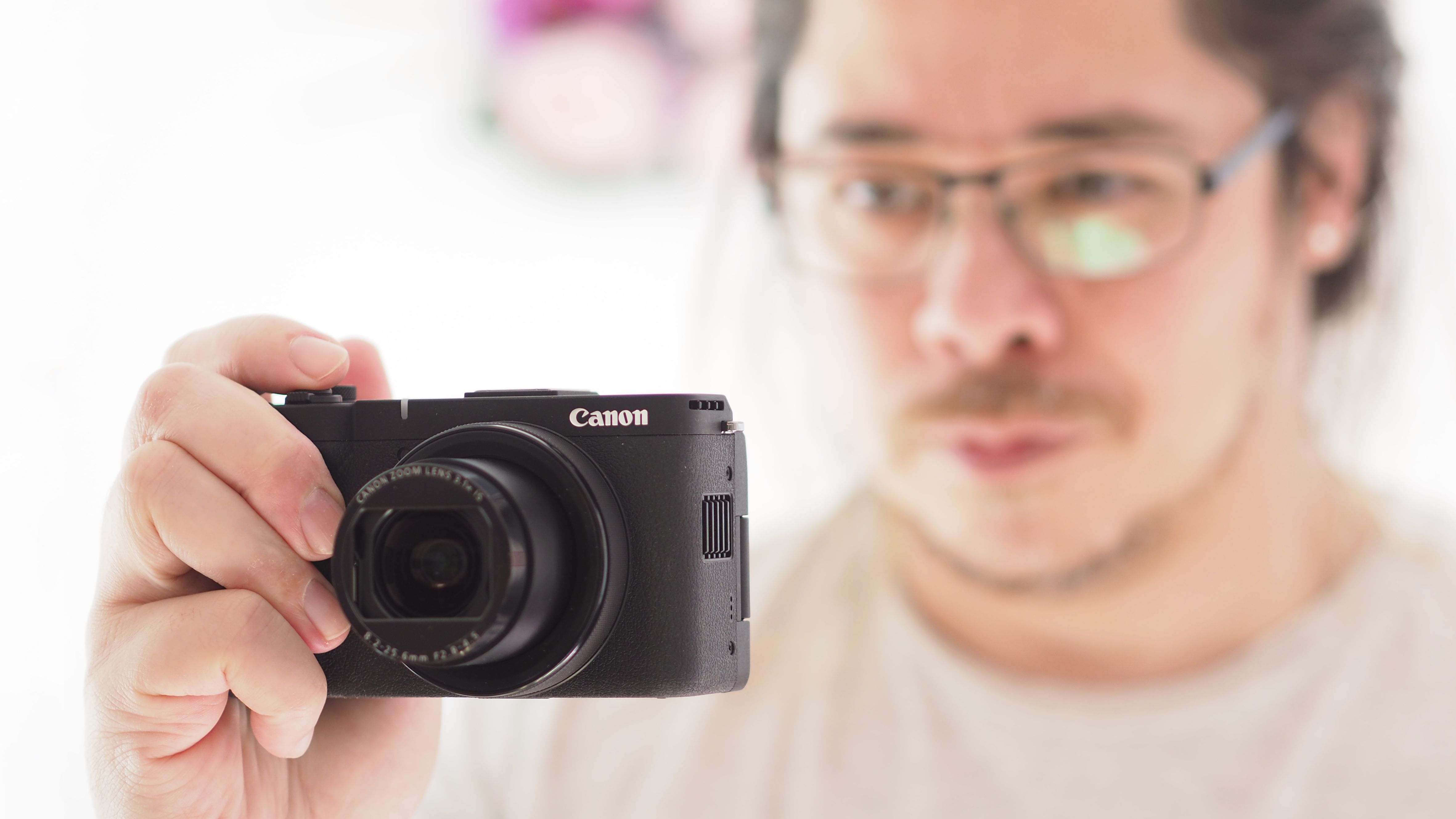 Reviewer James Artaius holding the Canon PowerShot V1