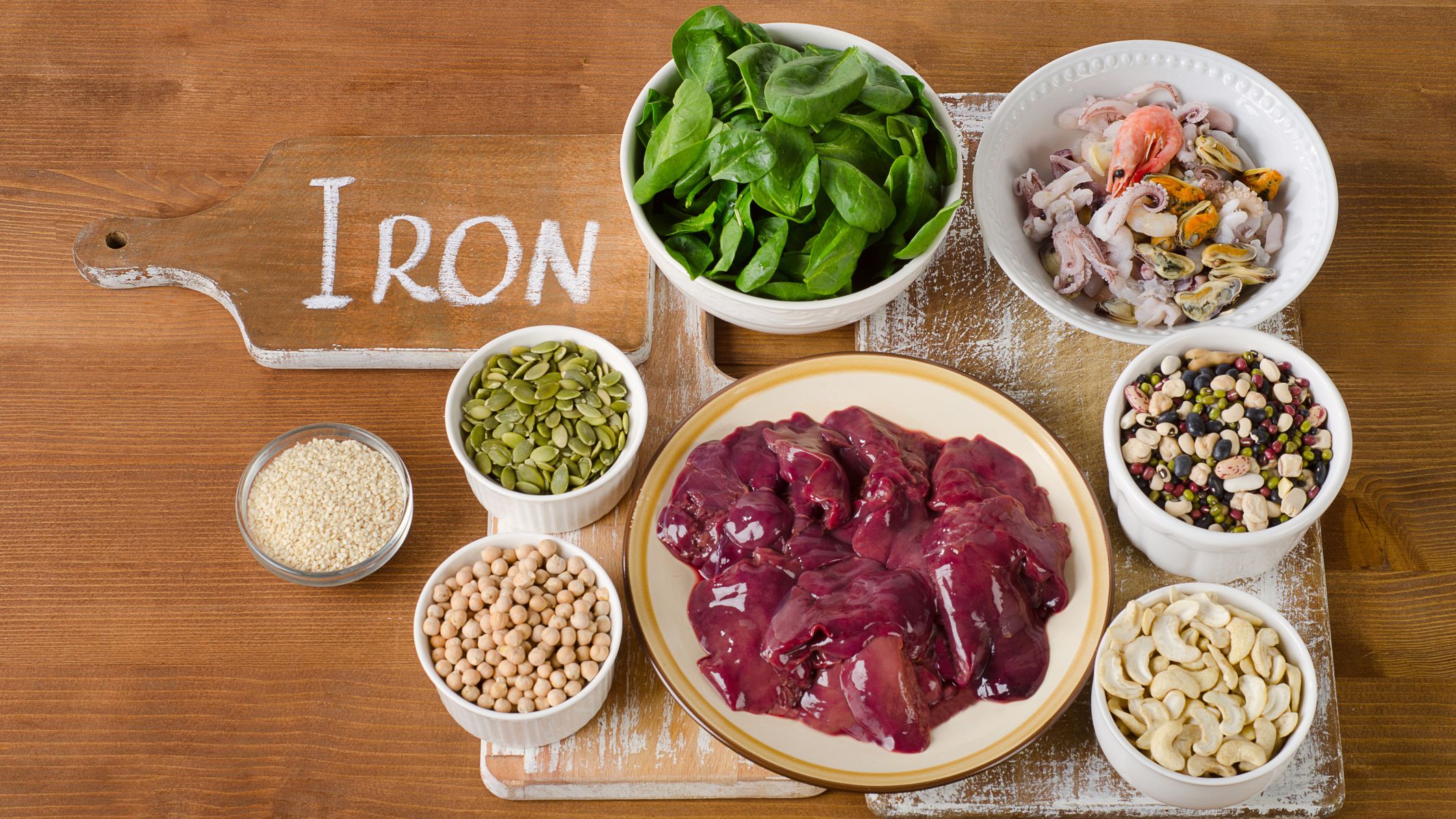 Foods high in Iron on wooden table. Top view
