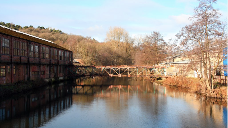 an image of the waterside White Peak Distillery in Ambergate, Derbyshire