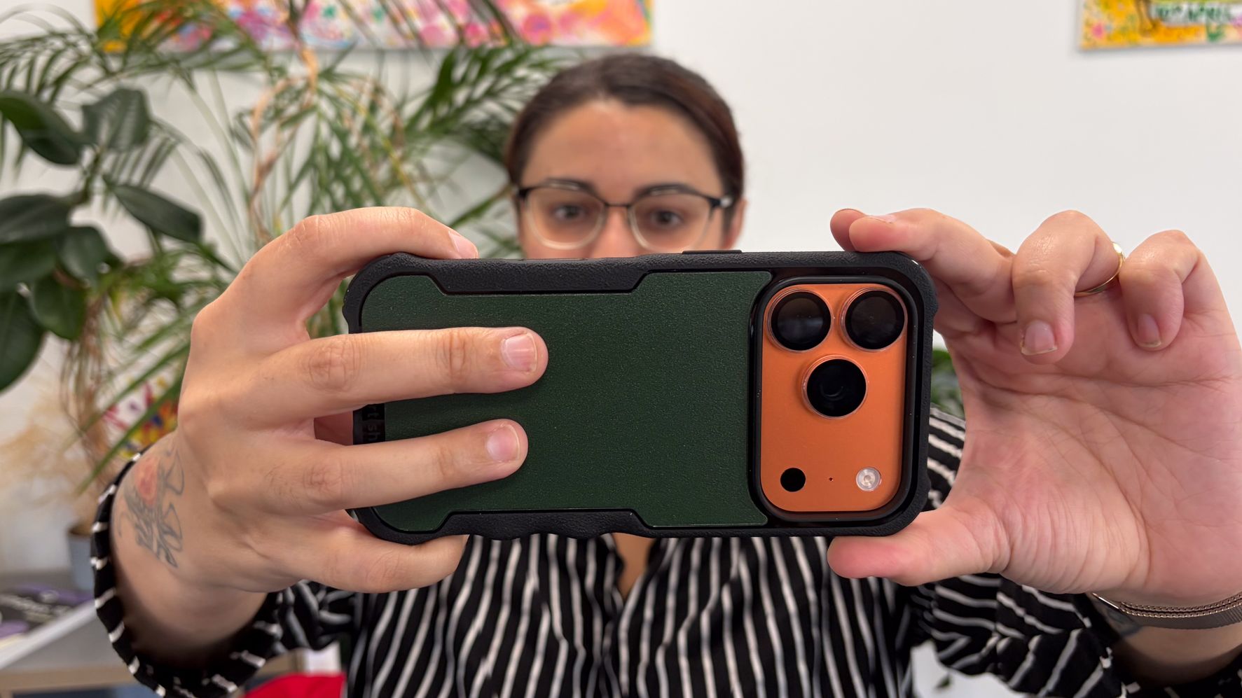 Person using an iPhone in a Smartish Gripzilla iPhone 18 Pro case