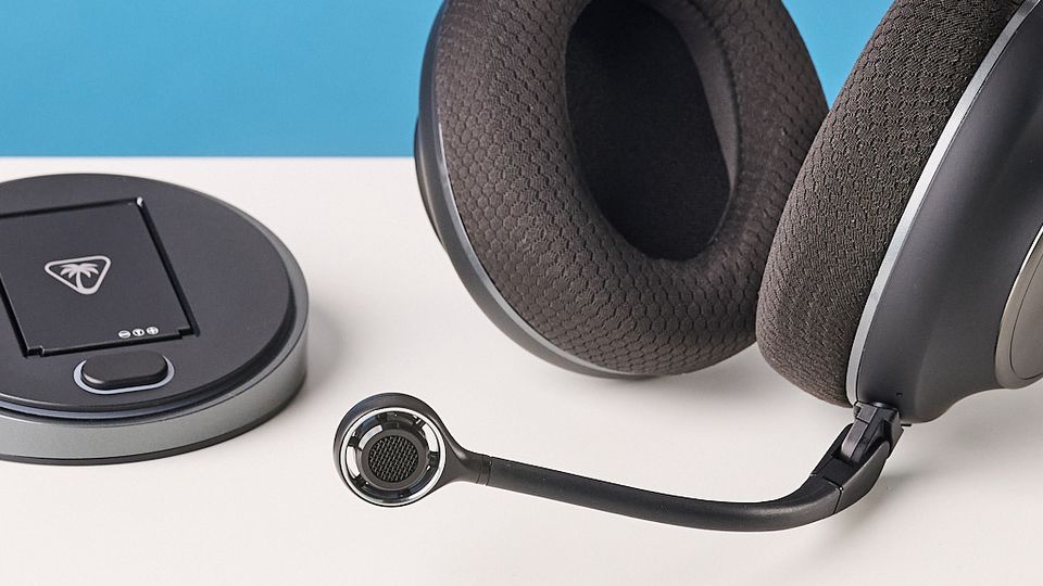 The Turtle Beach Stealth Pro II next to its base station and 2.4G dongle