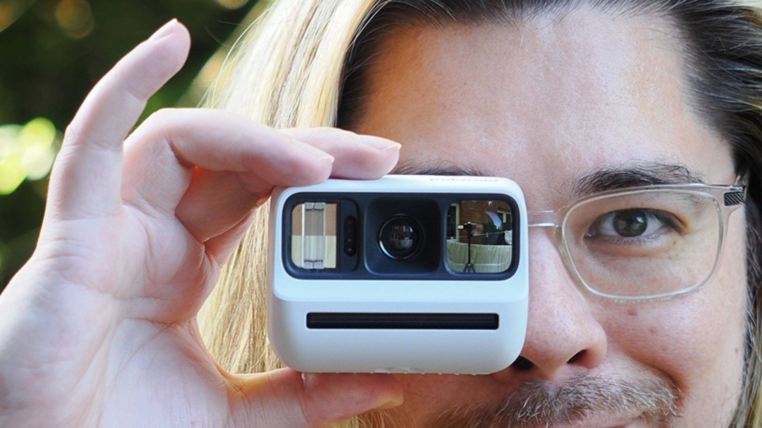 James Artaius using a Polaroid Go Gen 3 outdoors