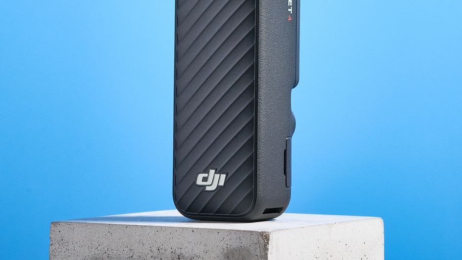 DJI Osmo Pocket 4 against a blue background