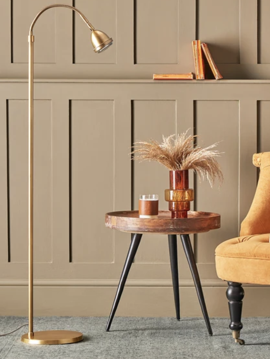 Floor lamp reading light next to side table and yellow occasional chair