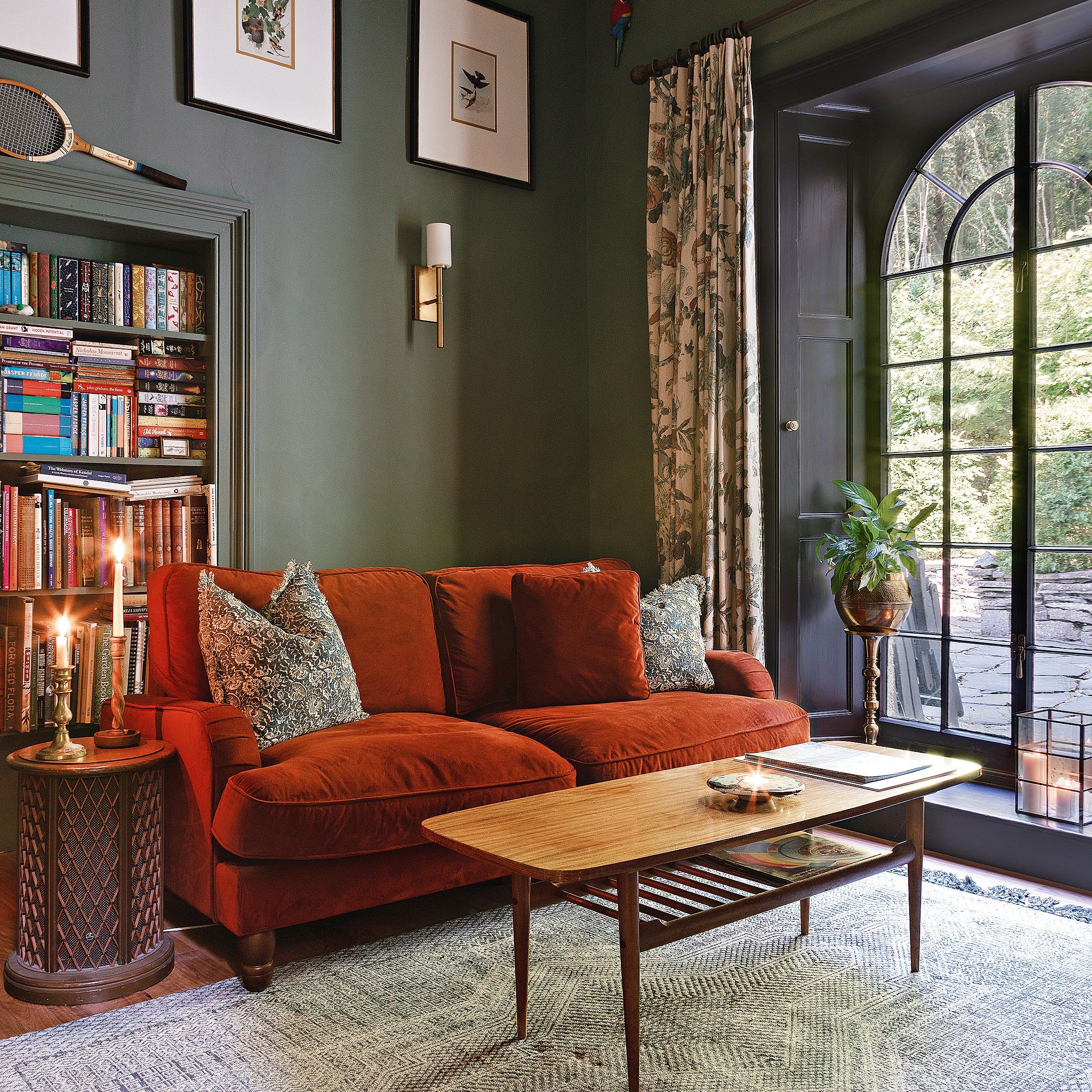 Dark green snug with arched window out to garden
