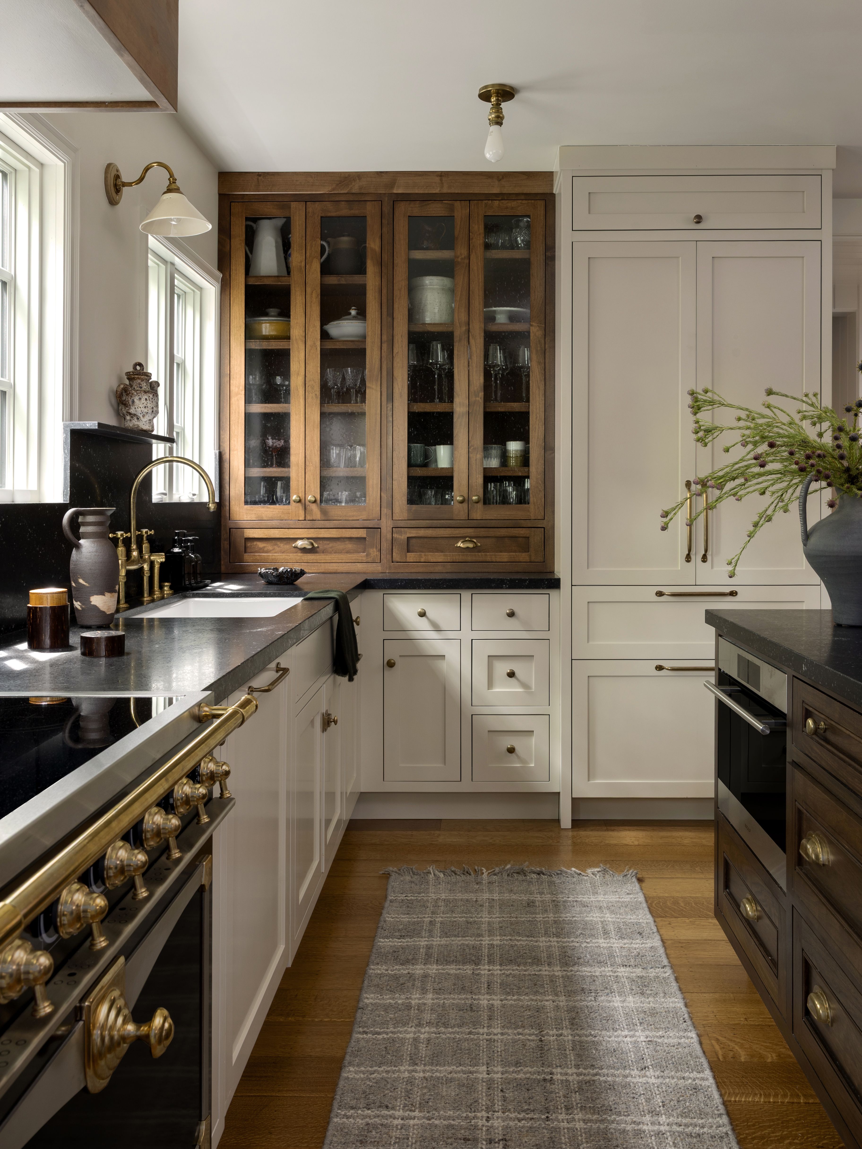 Neutral kitchen with tartan runner on wood flooring