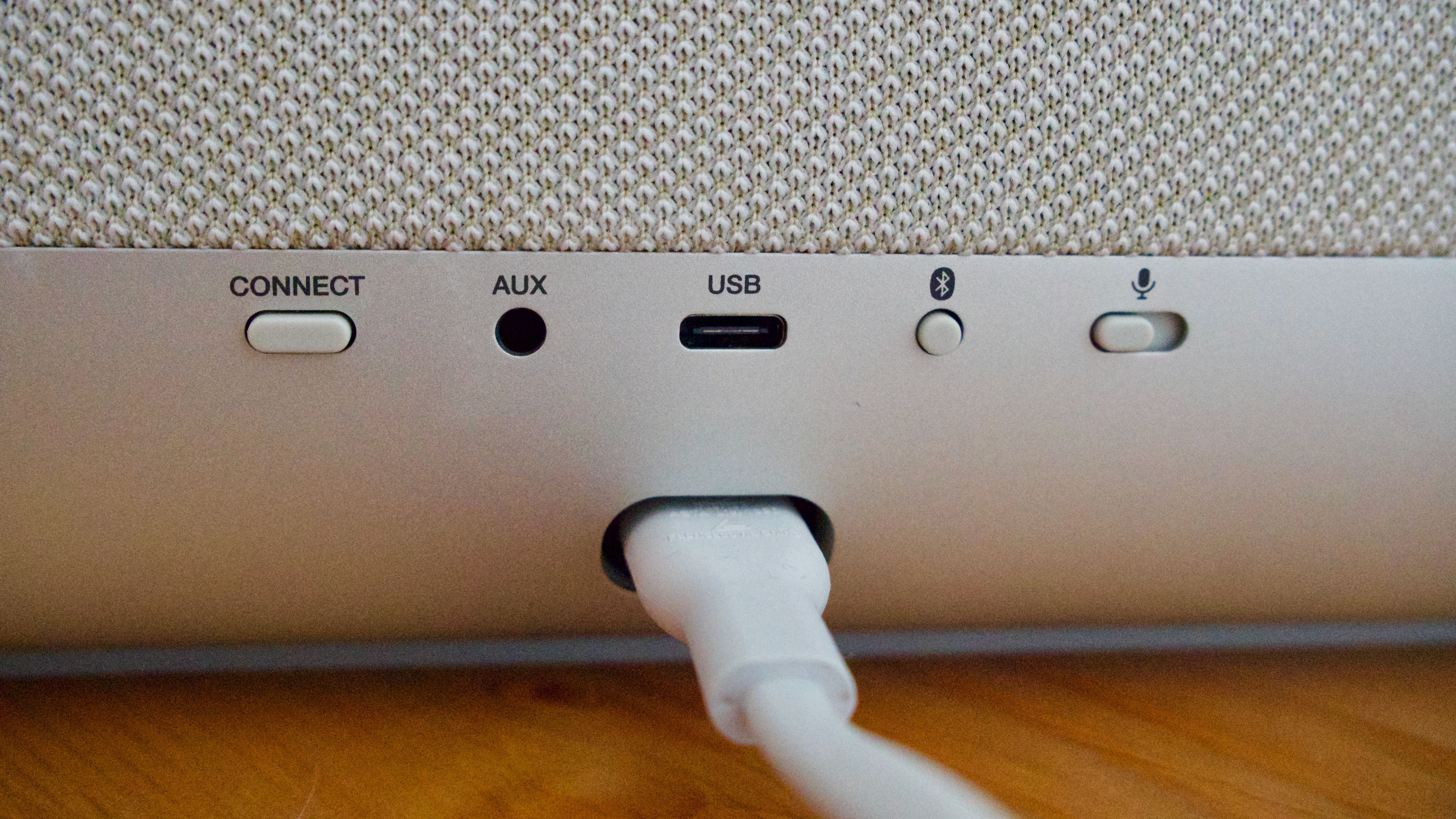 Rear panel of the Denon Home 400 home speaker, showing the USB-C port, Bluetooth button and AUX port.