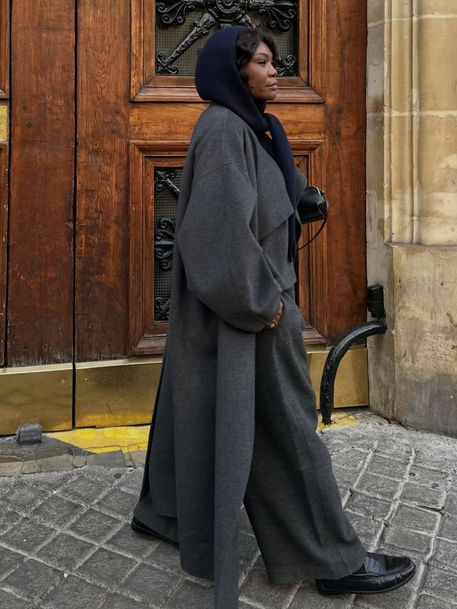 Fashion person Frannfyne shows shoe trends to wear with wide-leg trousers in 2026. she wears black loafers.