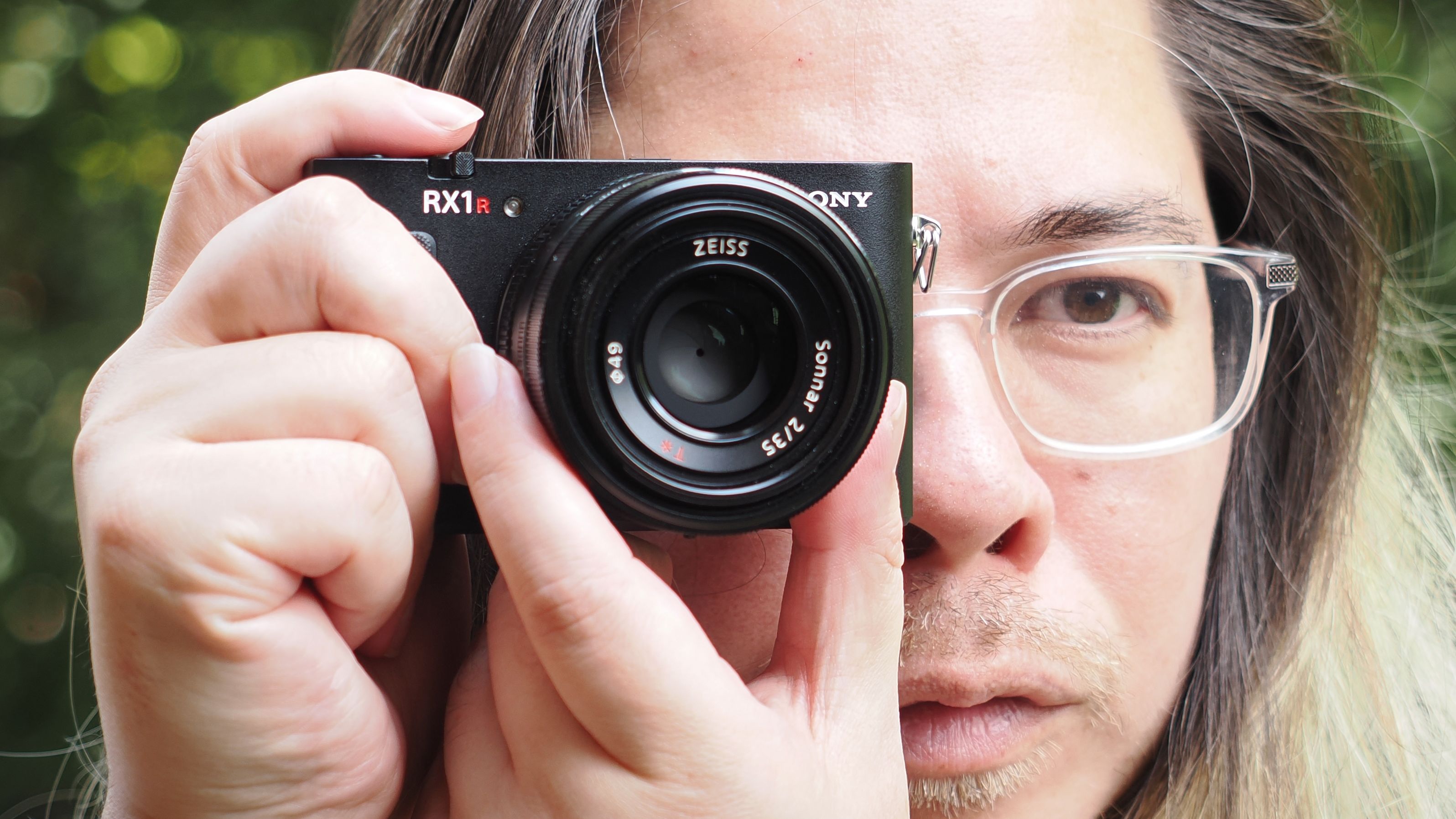 Photographer James Artaius holding the Sony RX1R III camera outdoors