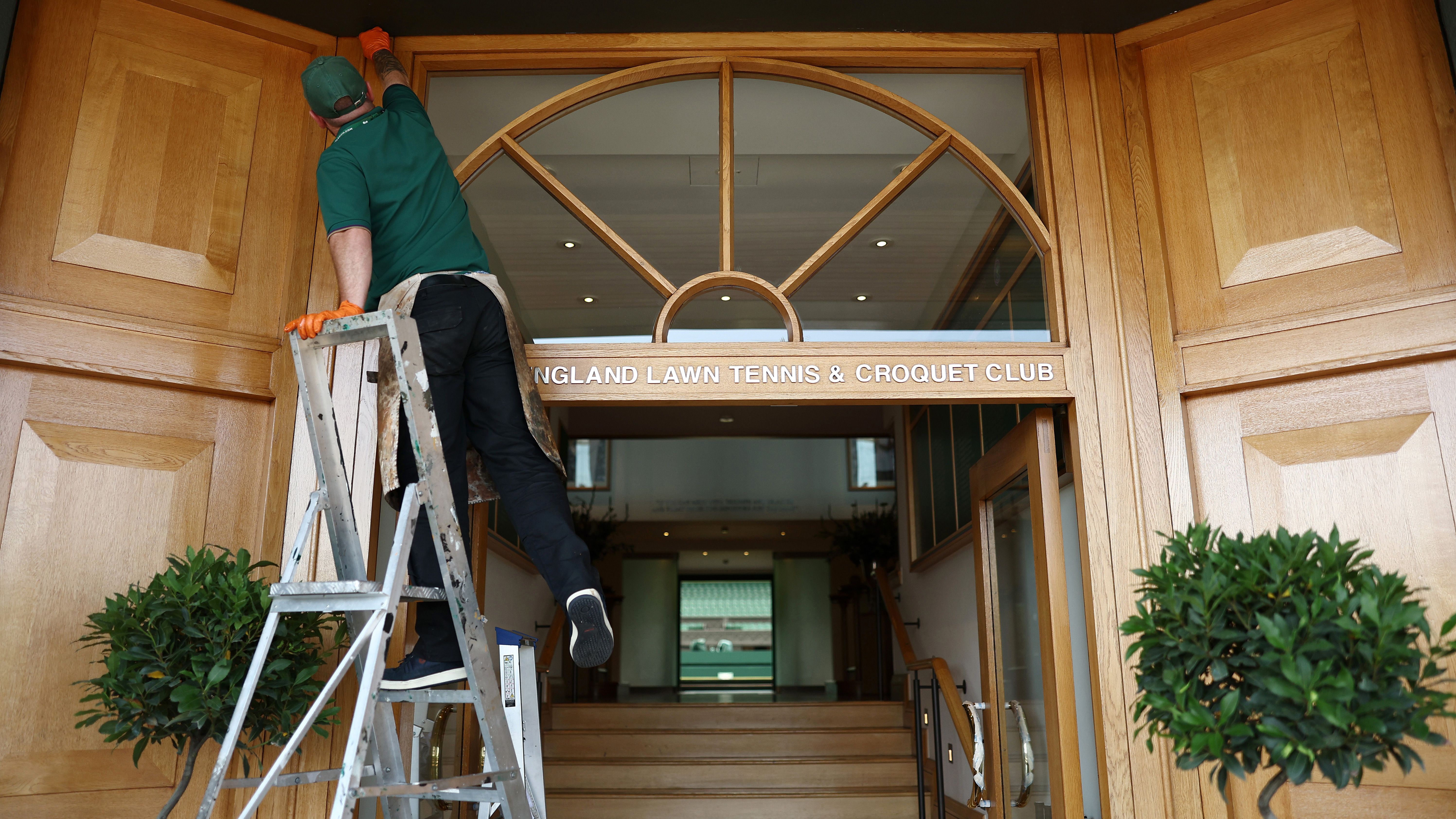 LONDON, ENGLAND - JUNE 25: Members of grounds&amp;amp;apos; staff perform restoration work to the entrance of the AELTC Clubhouse before The Championships Wimbledon 2026 at All England Lawn Tennis and Croquet Club on June 25, 2026 in London, England. (Photo by James Fearn/Getty Images)