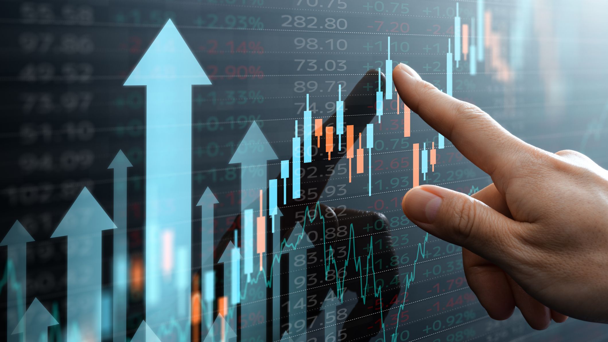 Analyst pointing at a candlestick chart