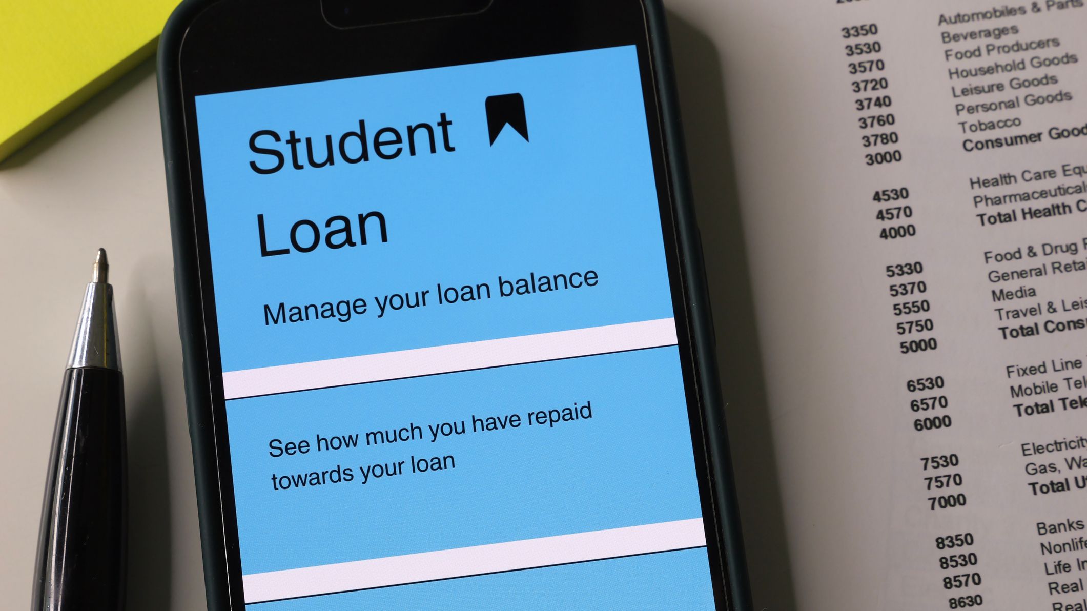 Mobile phone with financial app on screen.