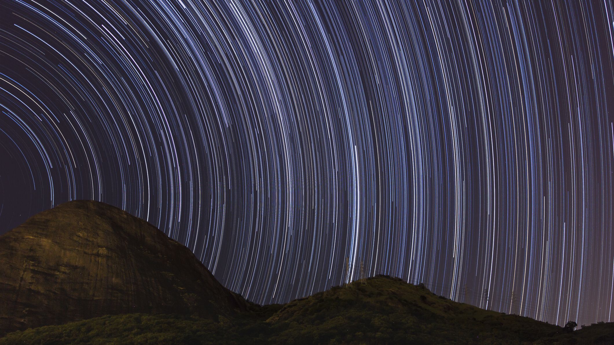 lots of streaks of light stretch through the sky