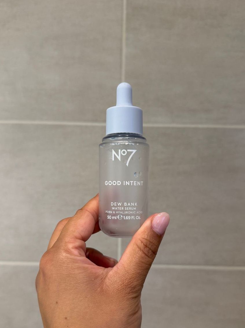 Aleesha holding empty No7 Good Intent Dew Bank serum